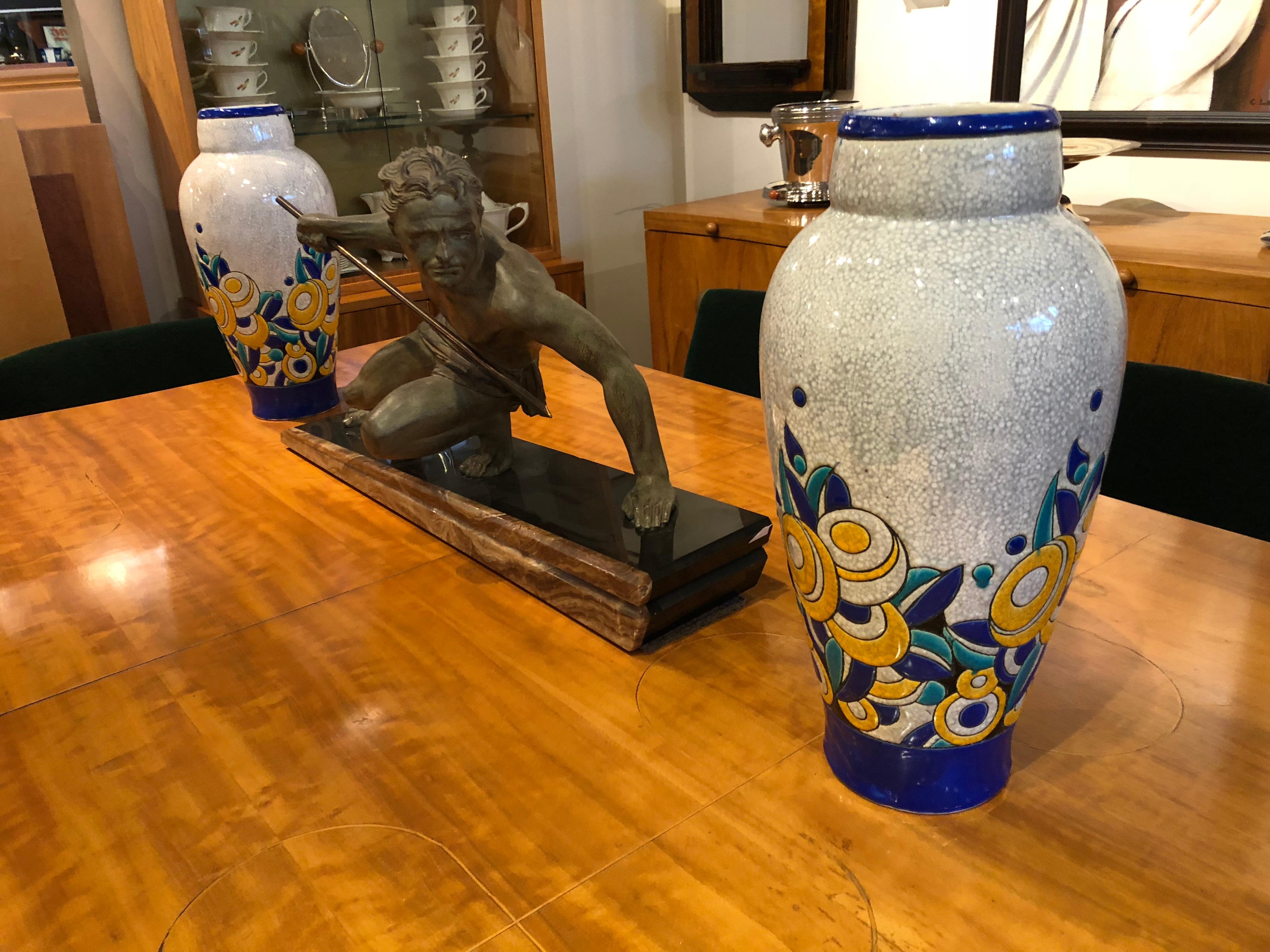 Stunning matching pair of large Boch Freres vases designed during the Charles Catteau period. Ceramic cloisonné is defined by colors contained by a line. You can see the hand made quality with the enamel paint which seems to expand beyond the line,