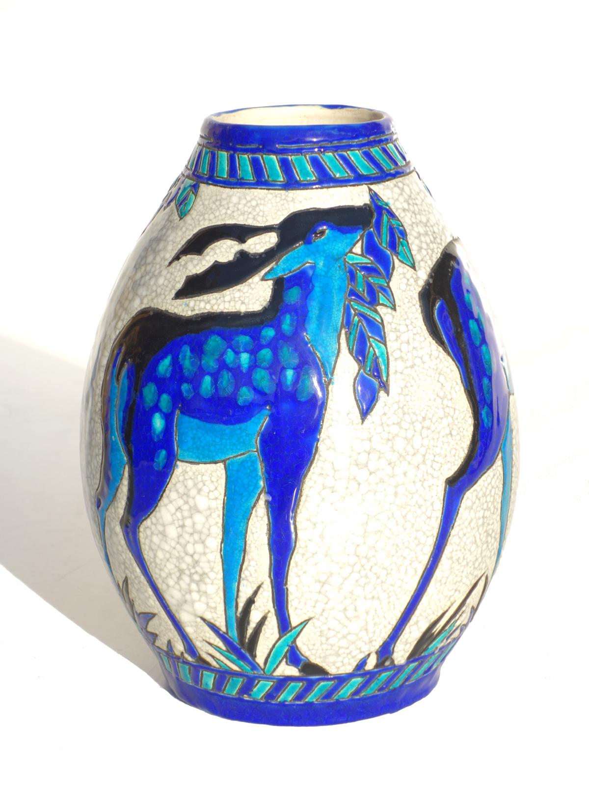 Fine Art Deco vase by Charles Catteau
Boch, La Louvier
Gres Keramis
Belgium, 1920 circa

Glazed ceramic with blue deer
Excellent condiction.
 