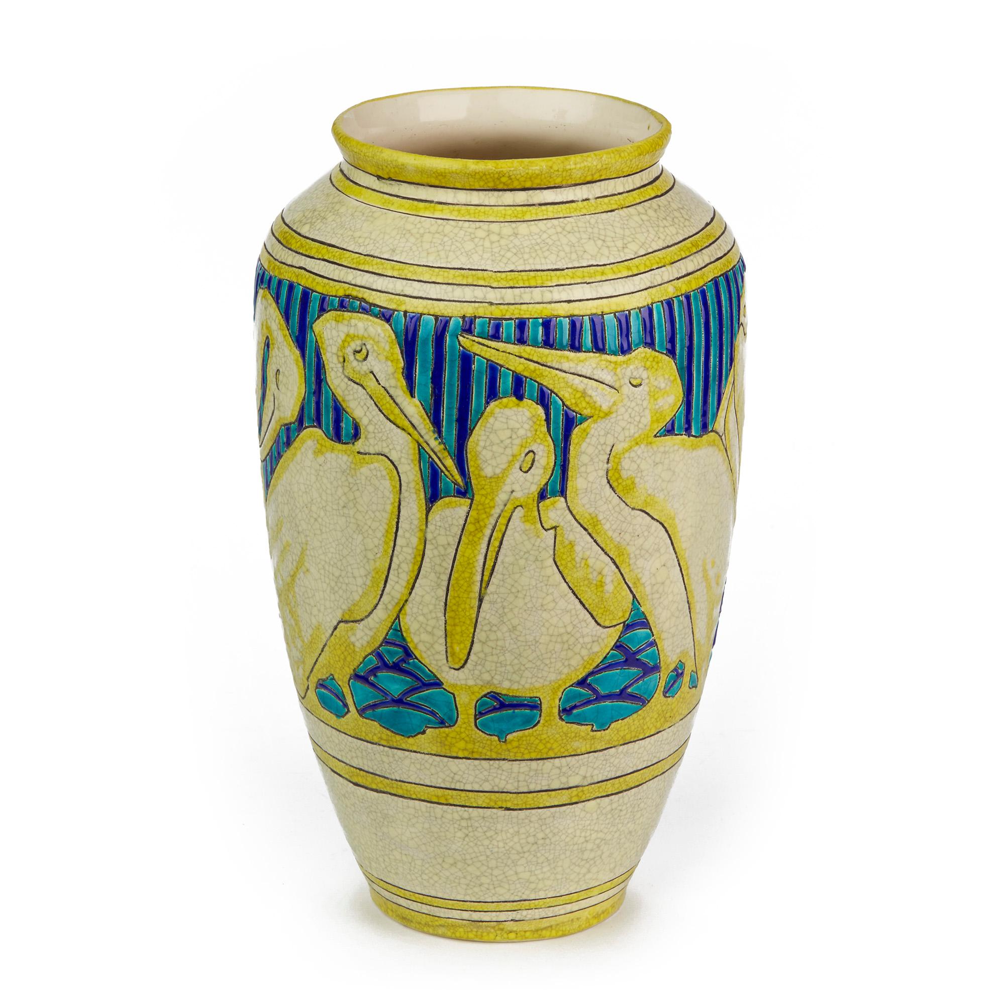Extremely rare and impressive Belgian Art Deco earthenware vase decorated with Pelicans designed by Charles Catteau for Boch Frères Keramis and created in 1925. This large bulbous vase is decorated with stylized Pelicans in various attitudes around