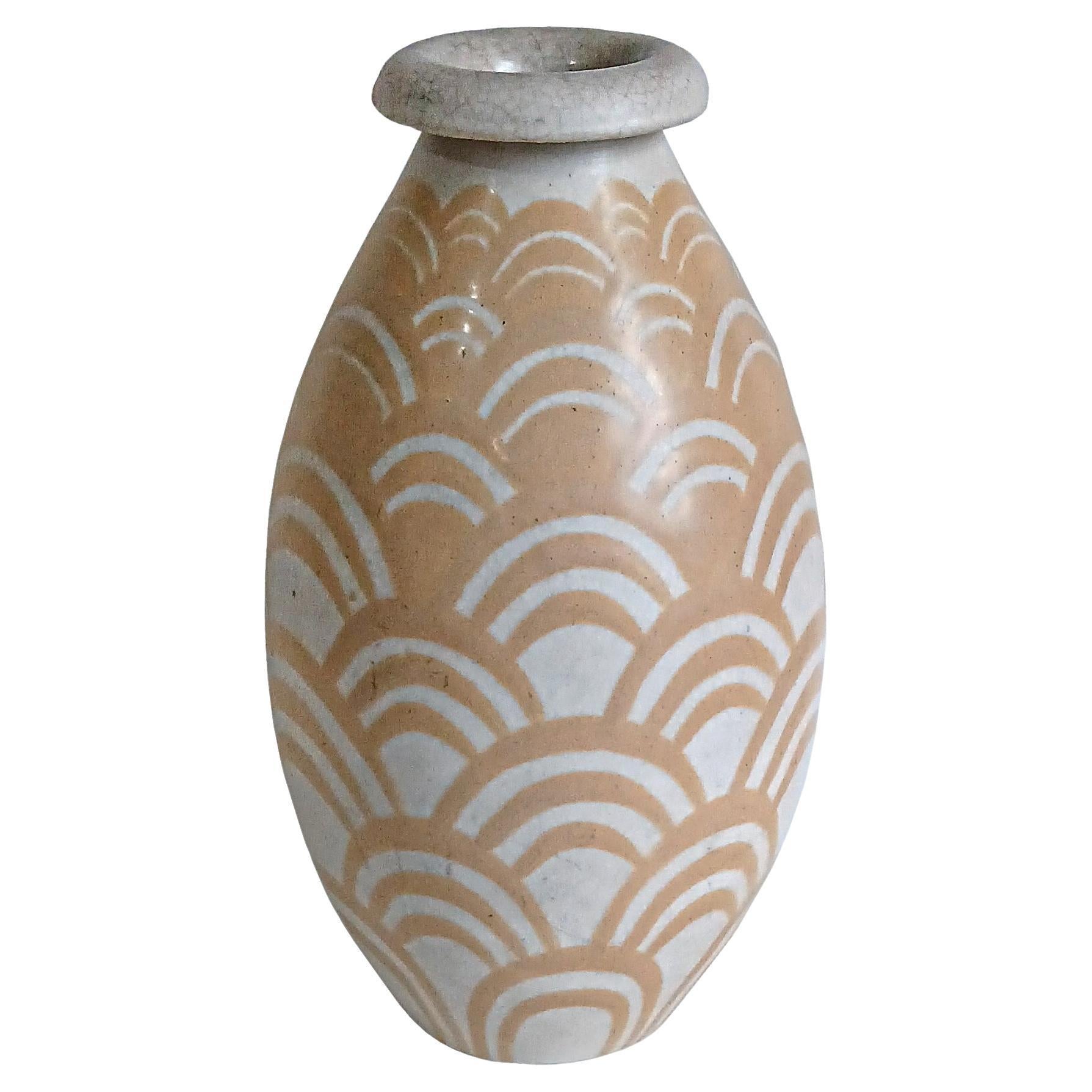 A superb ceramic vase crafted by Charles Catteau (1880-1966), for Boch Freres, Belgium, early 20th Century. 

In 1906, Catteau moved to La Louvière, Belgium, to work as a designer at Boch Frères Keramis. This company dominated the Belgian ceramics