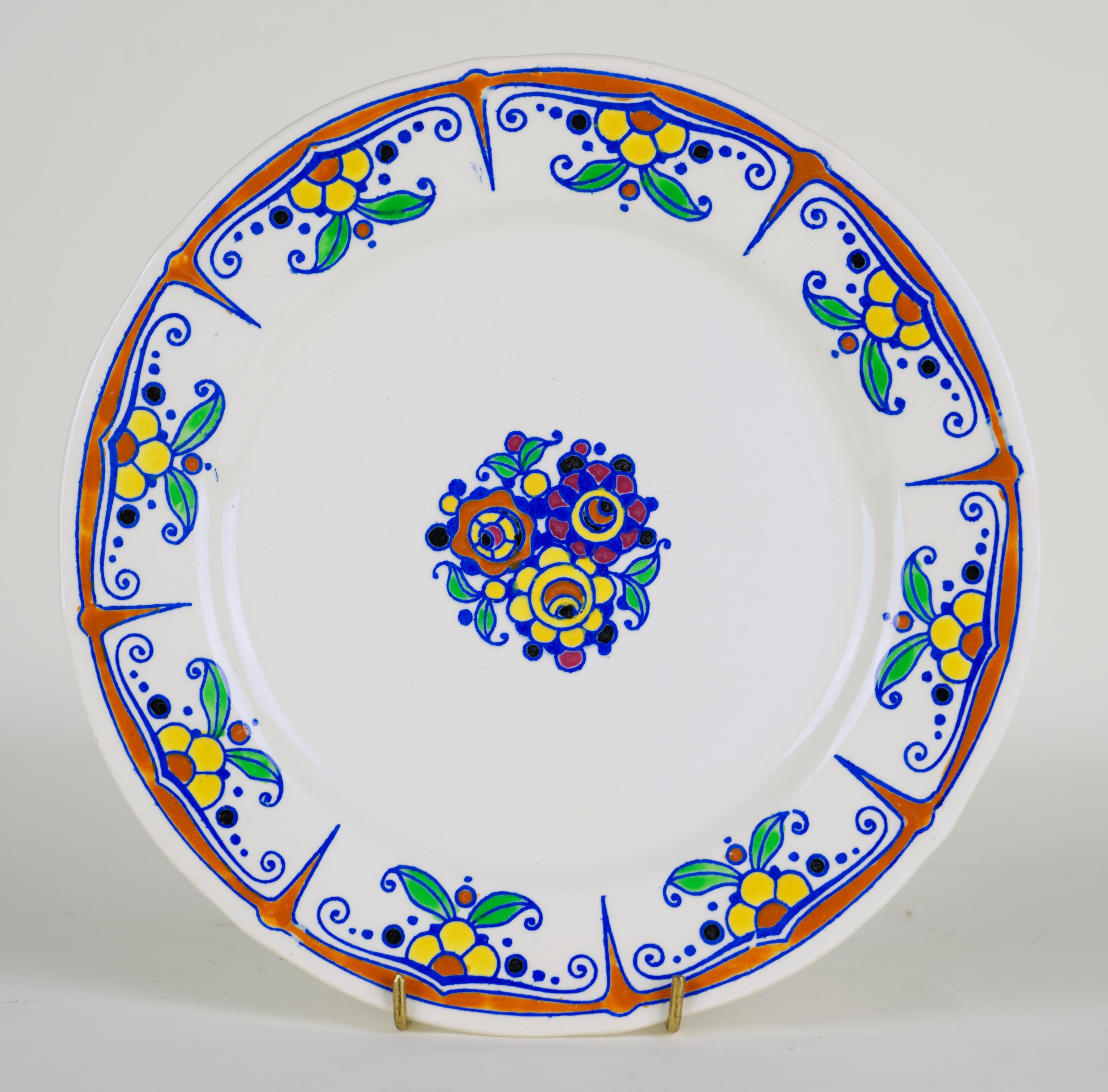 
Four extremely rare faience salad plates are hand-painted on ecru background with Art Deco style orange and yellow flowers and green leaves. This design was widely used on various vases signed by Charles Catteau; there are multiple examples in