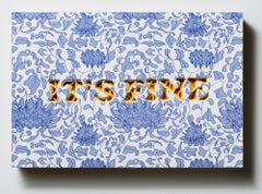 "IT'S FINE" Text, layered and hand-cut paper, mounted on wood panel