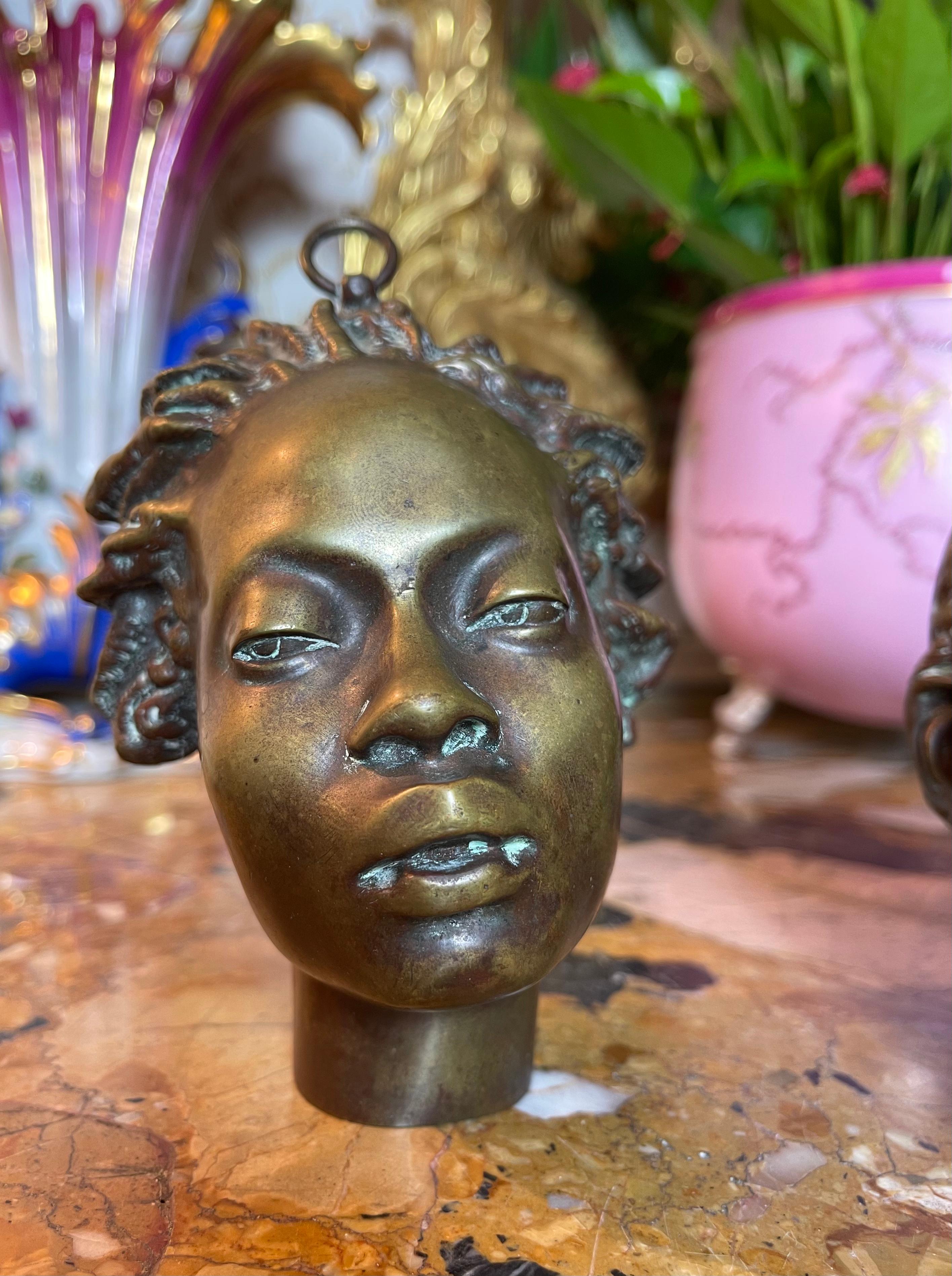 Bronze sculptures by Charles Cordier representing the faces of Saïd Abdallah from the tribe of Mayac, Kingdom of Darfur and an African Venus.
Artist - Charles Henri Joseph Cordier (1827-1905) French sculptor 

Dimensions - Saïd Abdallah height