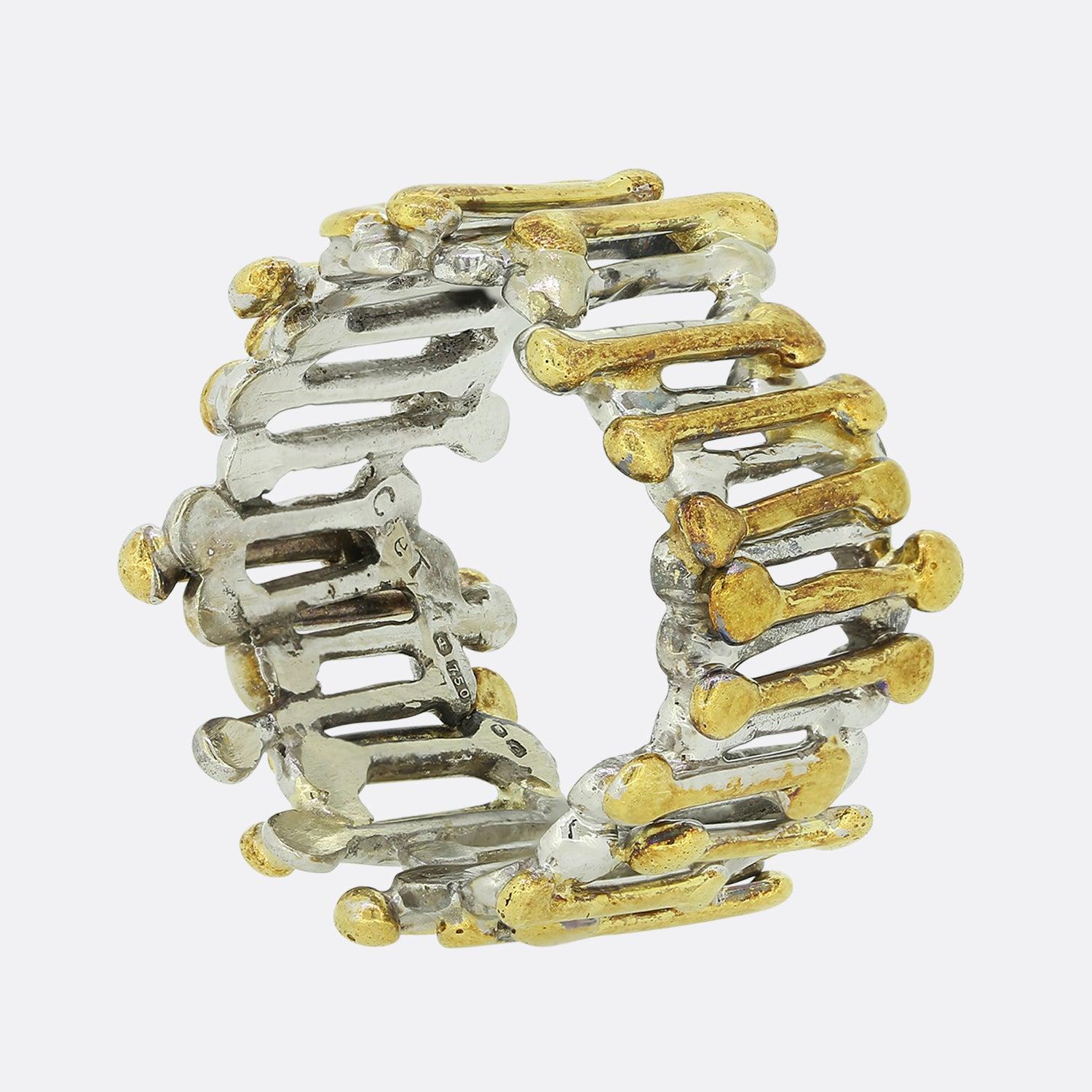 This is an 18ct gold ring from the luxury jewellery designer Charles De Temple. The ring features a layered design with both white and yellow gold sections. It is fully hallmarked to the year 1977 and marked 'CdeT'. This is a rare style and we have