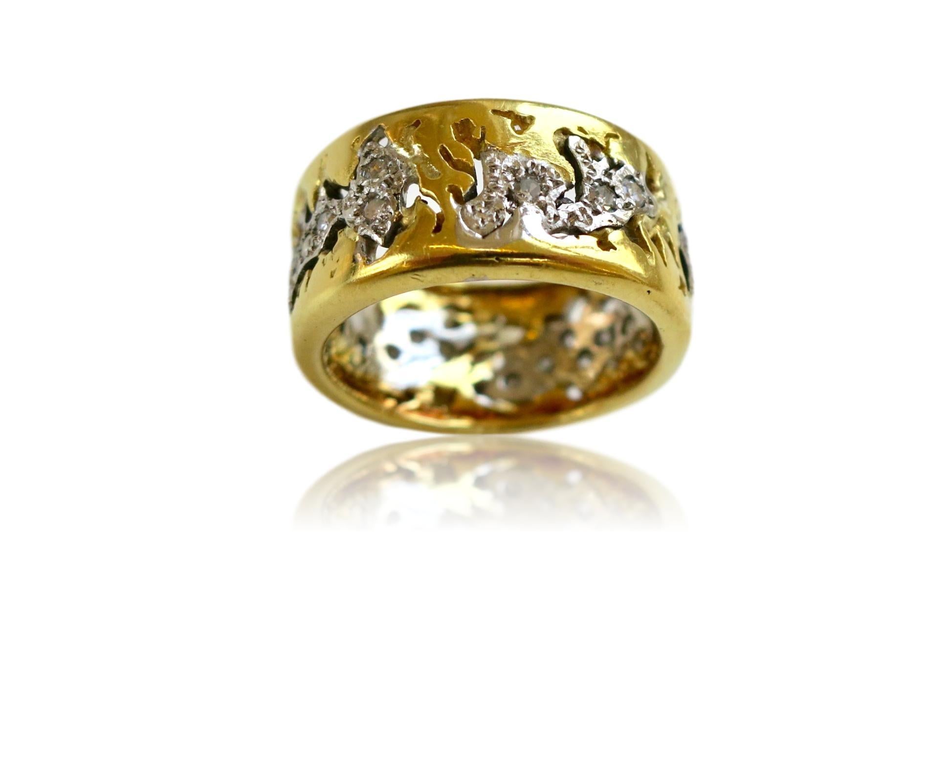18k Yellow and white gold and diamond ring by British designer Charles de Temple. The pierced-work 3/8