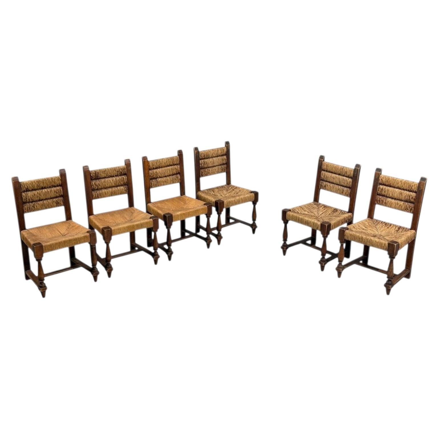 Charles Dudouyt, Six Rustic Dining Chairs, Oak, Rush, France, 1940s For Sale
