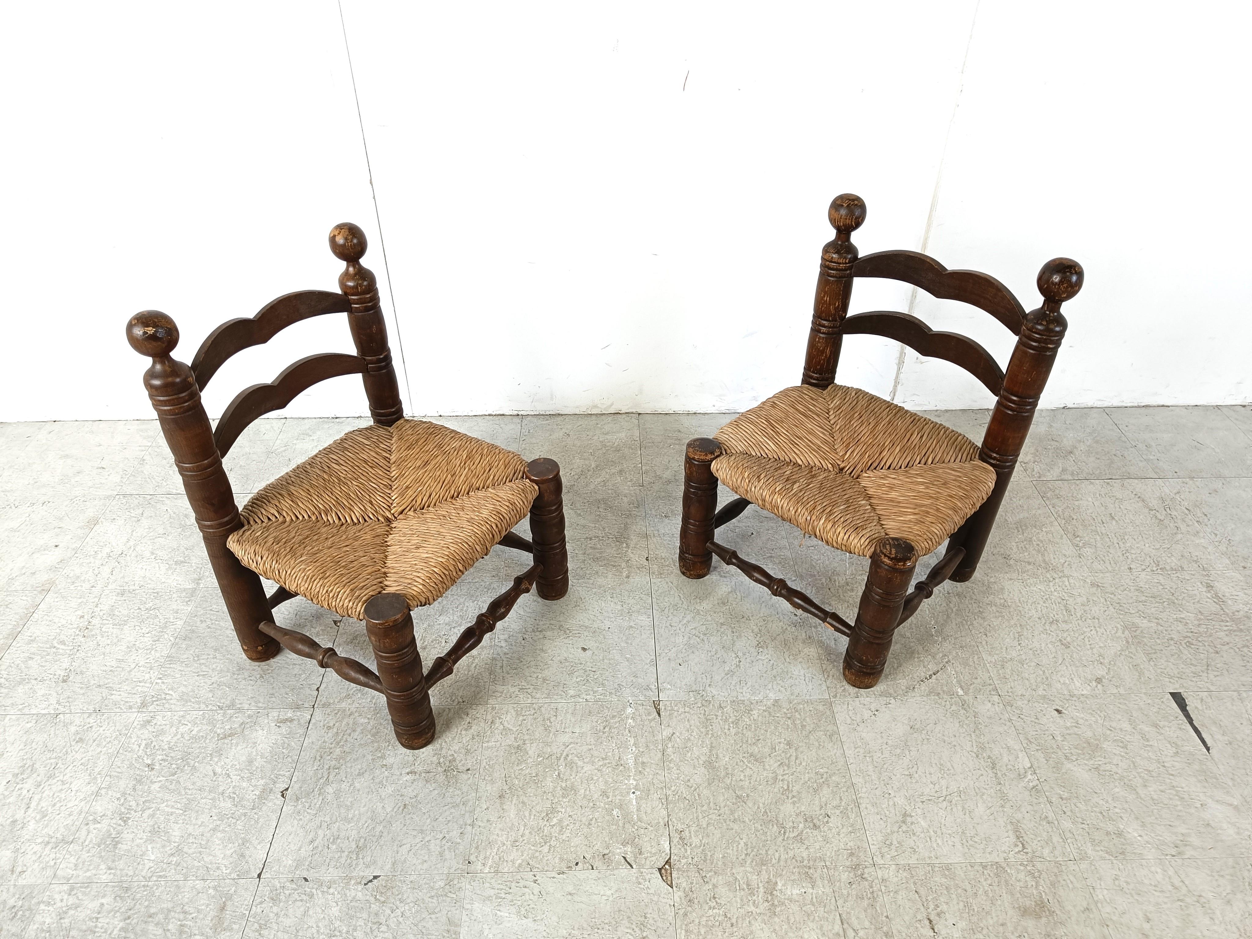 Sturdy brutalist side chairs or children chairs attributed to Charles Dudouyt.

Made from stained oak and wicker seats.

Good condition.

1960s - France

Dimensions:

Height: 70cm/27.55