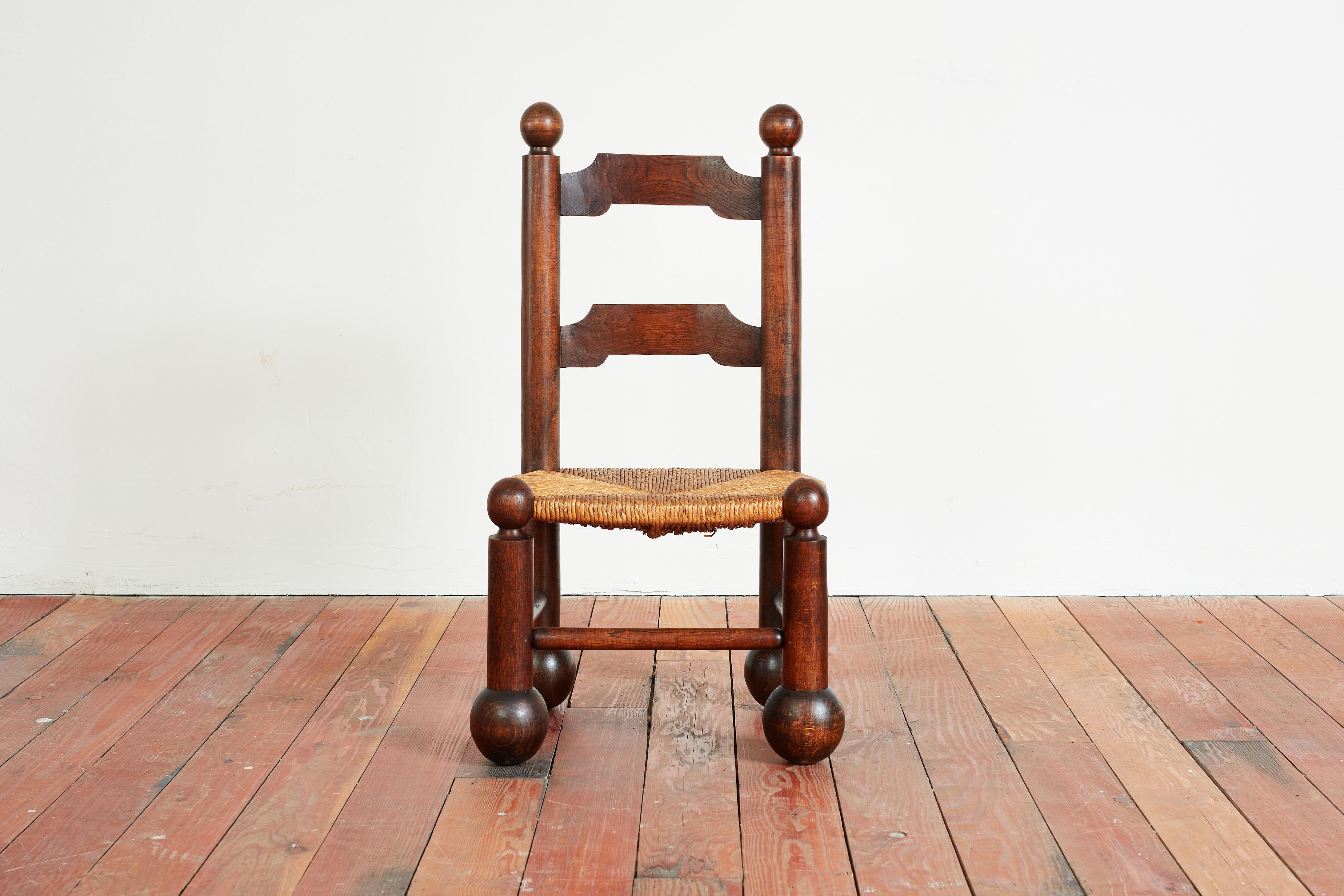 Charles Dudouyt side chair - France 1940s 
Large carved ball shaped feet with signature rushed seat.

