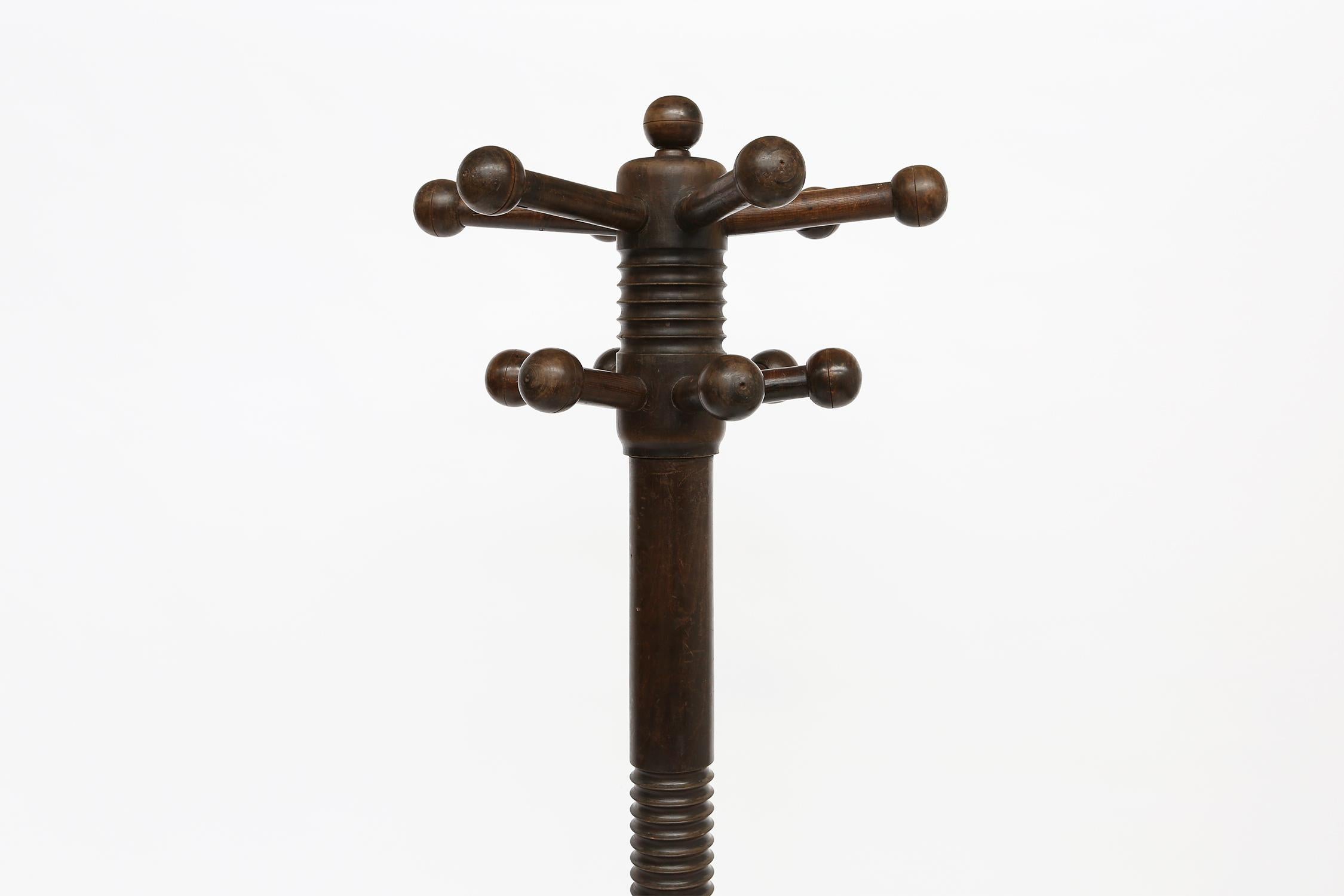 Rare coat stand by Charles Dudouyt with corkscrew detail and 4 ball footed base. Two rows of balled coat hooks Wonderful patina and impressive in scale. 

