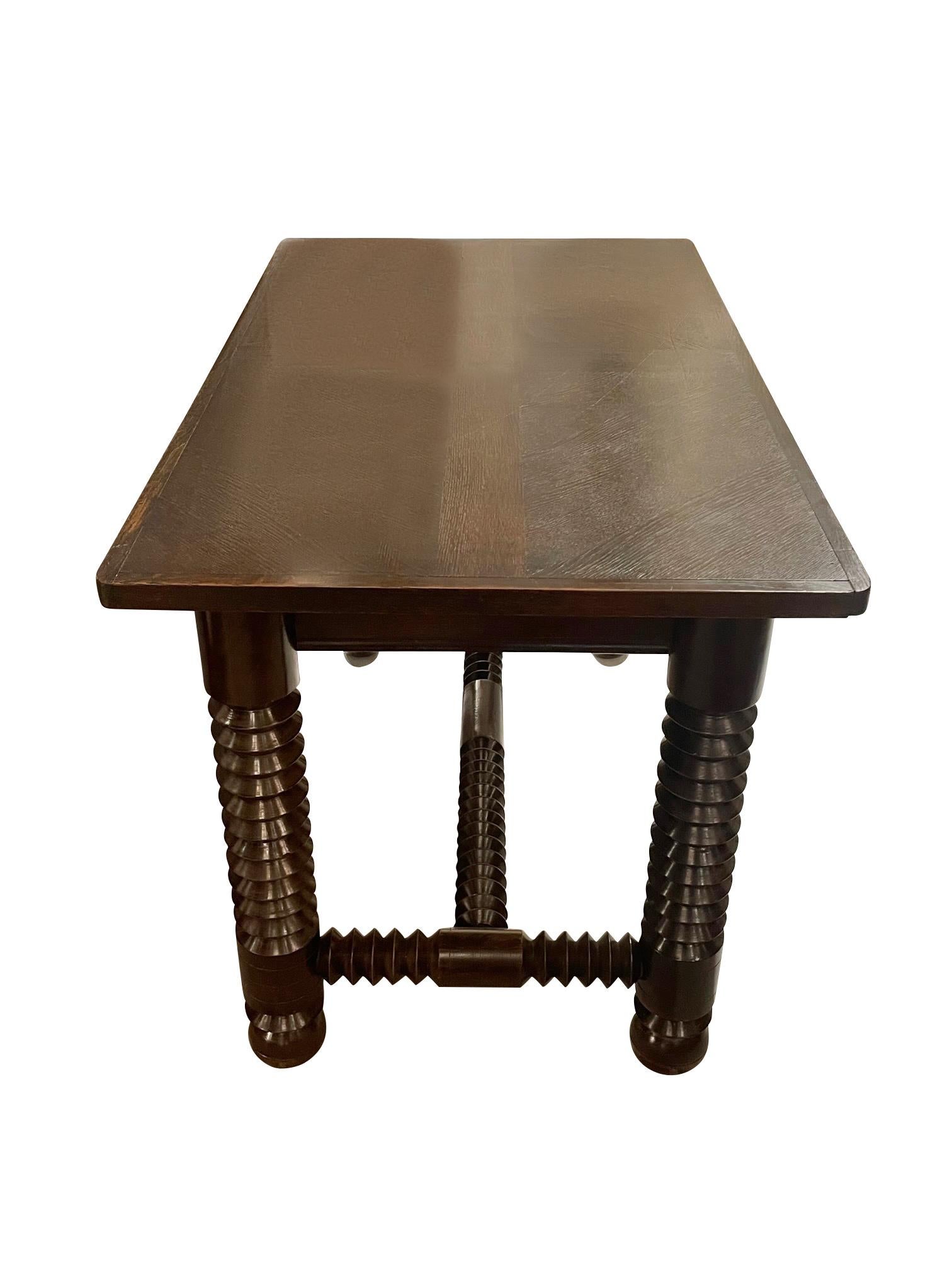 1940's French Charles Dudouyt console.
Can also be used as a desk.
Signature spool leg and stretcher design. 
Ball shaped legs.
Recently restored and refinished.
