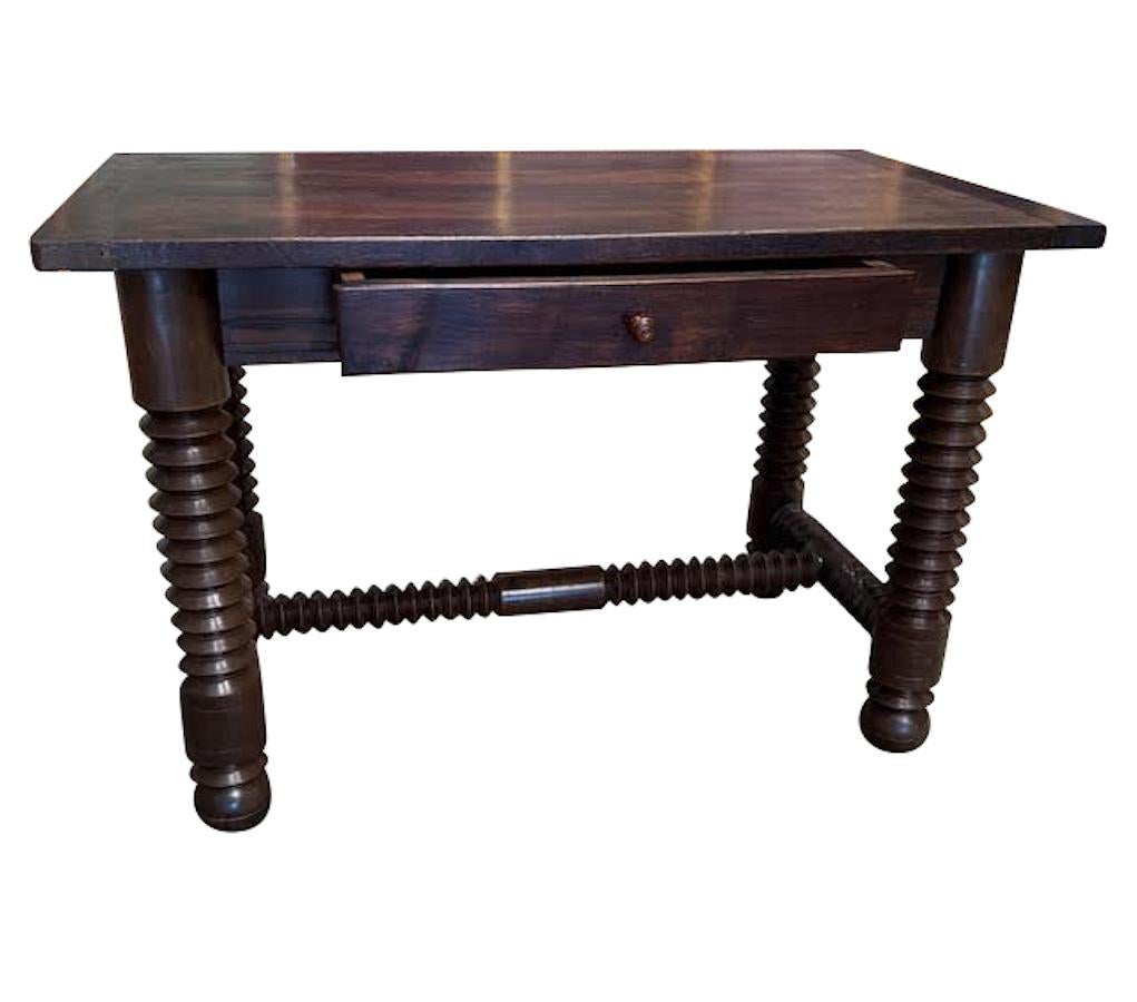 1940's French Charles Dudouyt center drawer desk.
Can also be used as a side table.
Signature spooled legs and cross supports.
Ball shaped footings.
Newly refinished.
Oak wood.
Height from floor to bottom of apron  24