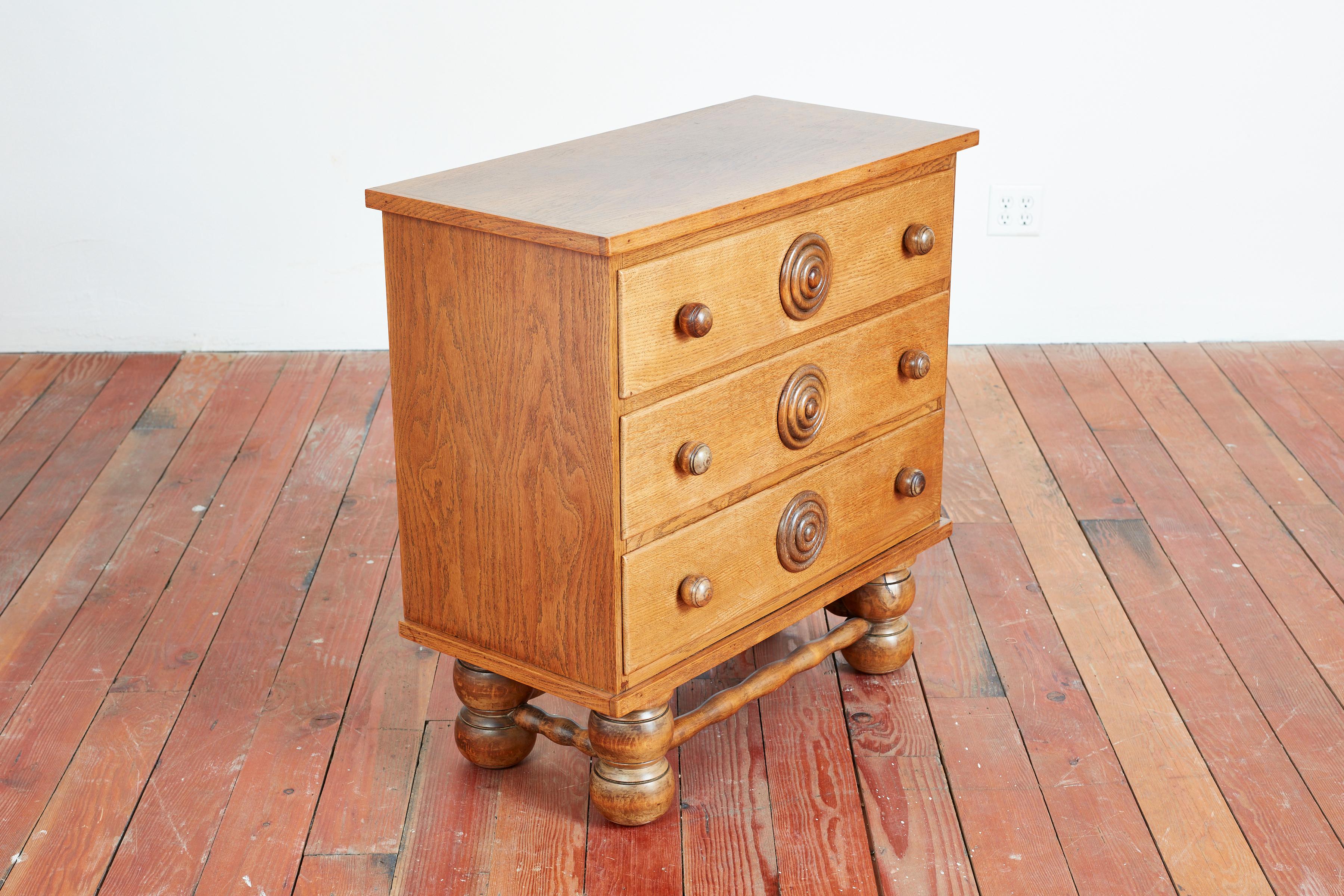 Charles Dudouyt 3 drawer dresser - France, 1940s 
Warm oak patina with signature bulbous legs and carved bullseye handles.
