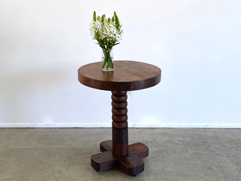 Charles Dudouyt side table with thick chunky pedestal base
Signature carved bulbous corkscrew base 
Wonderful dark oak patina 
Rare piece.