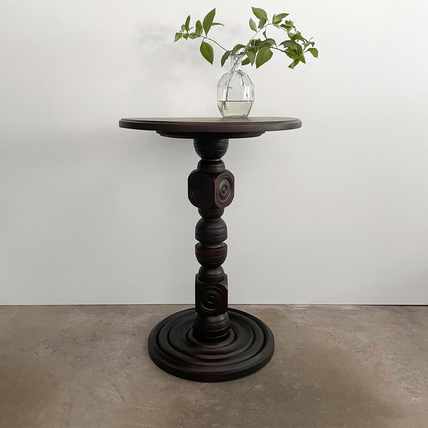 Charles Dudouyt carved oak table
France, 1940s
Handcrafted artisanal piece 
Beautifully sculpted carved oak pedestal 
Carved concentric circle detailing on the turned wood base
Natural color variations throughout 
Light surface markings 
Patina from