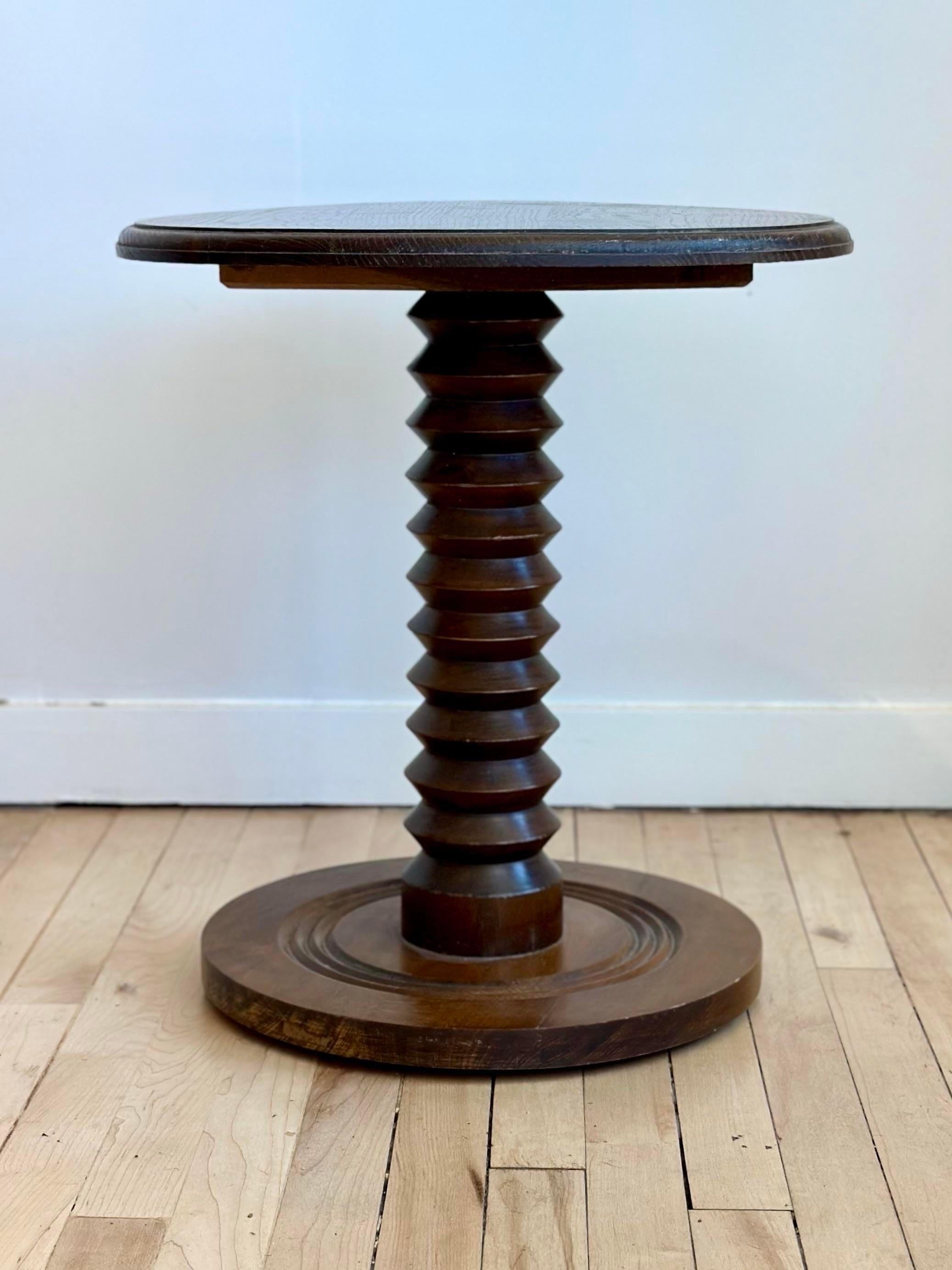 A 1940’s French brutalist gueridon or end table, made of oak. Designed by Charles Dudouyt, with a ‘wine press screw’ carved pedestal leg. Ideal for displaying a large planter or sculpture.