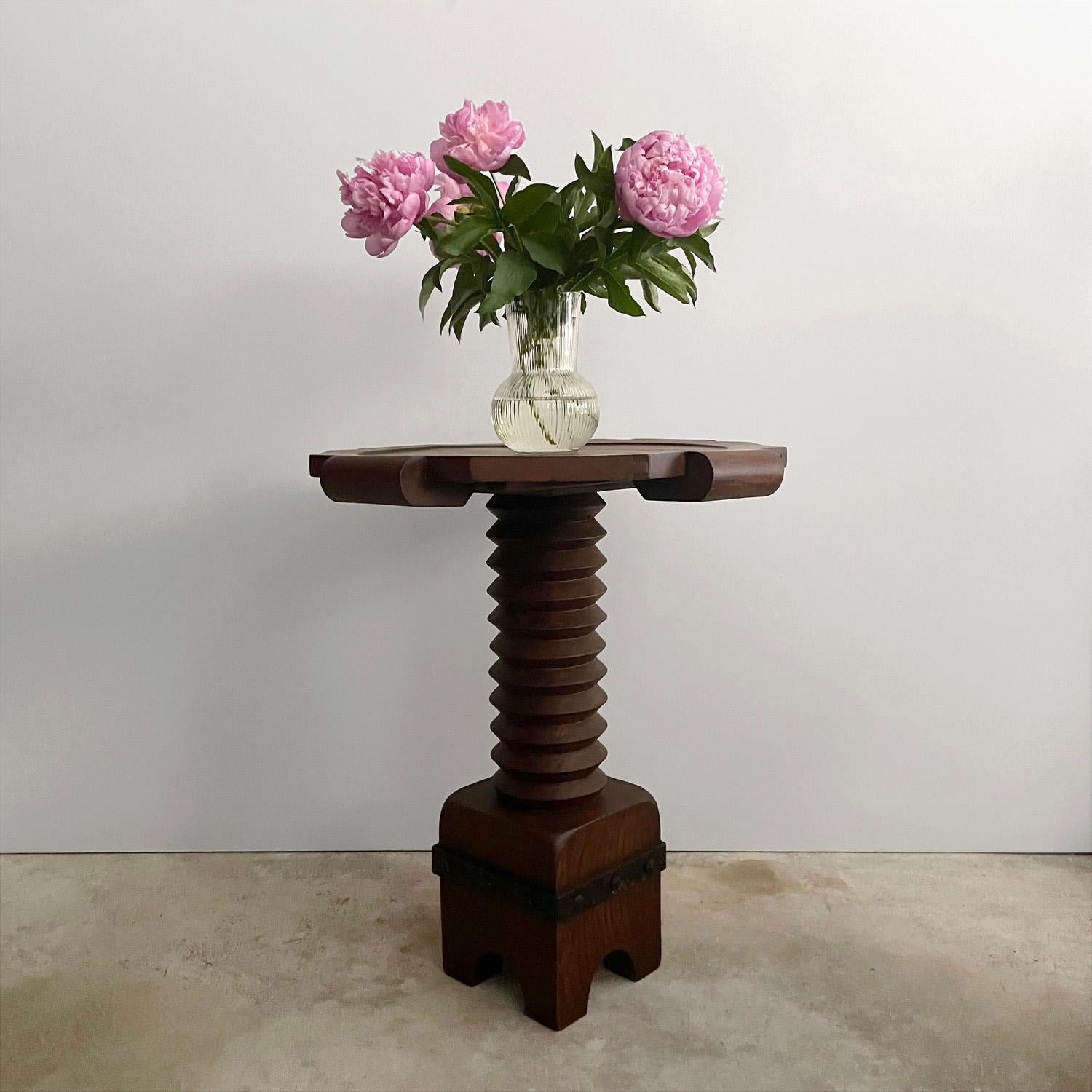 Charles Dudouyt walnut pedestal table
France, circa 1940s
This wonderful table is all about the details
Hand crafted artisanal piece
Octagonal tabletop with inlaid circular recess and rounded handles
Table surface is slightly irregular
Lovely wood