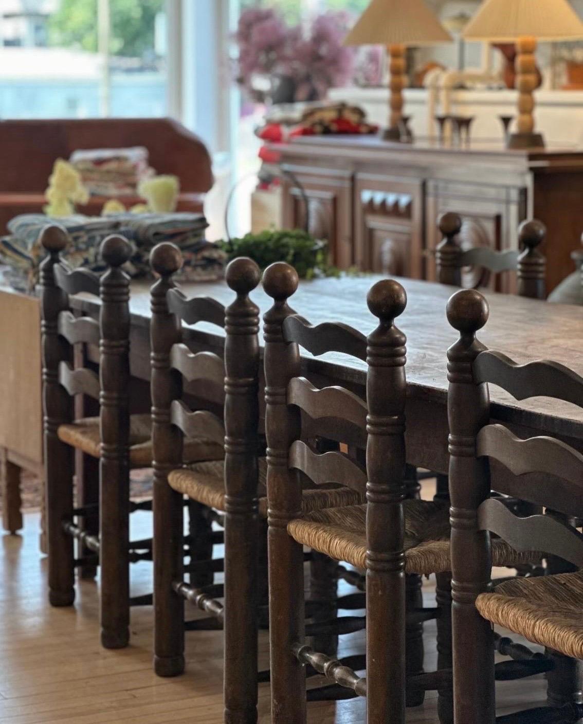 Fabulous French ladder back dining chairs designed by Charles Dudouyt. Solid oak frames & rush seats, circa 1940.