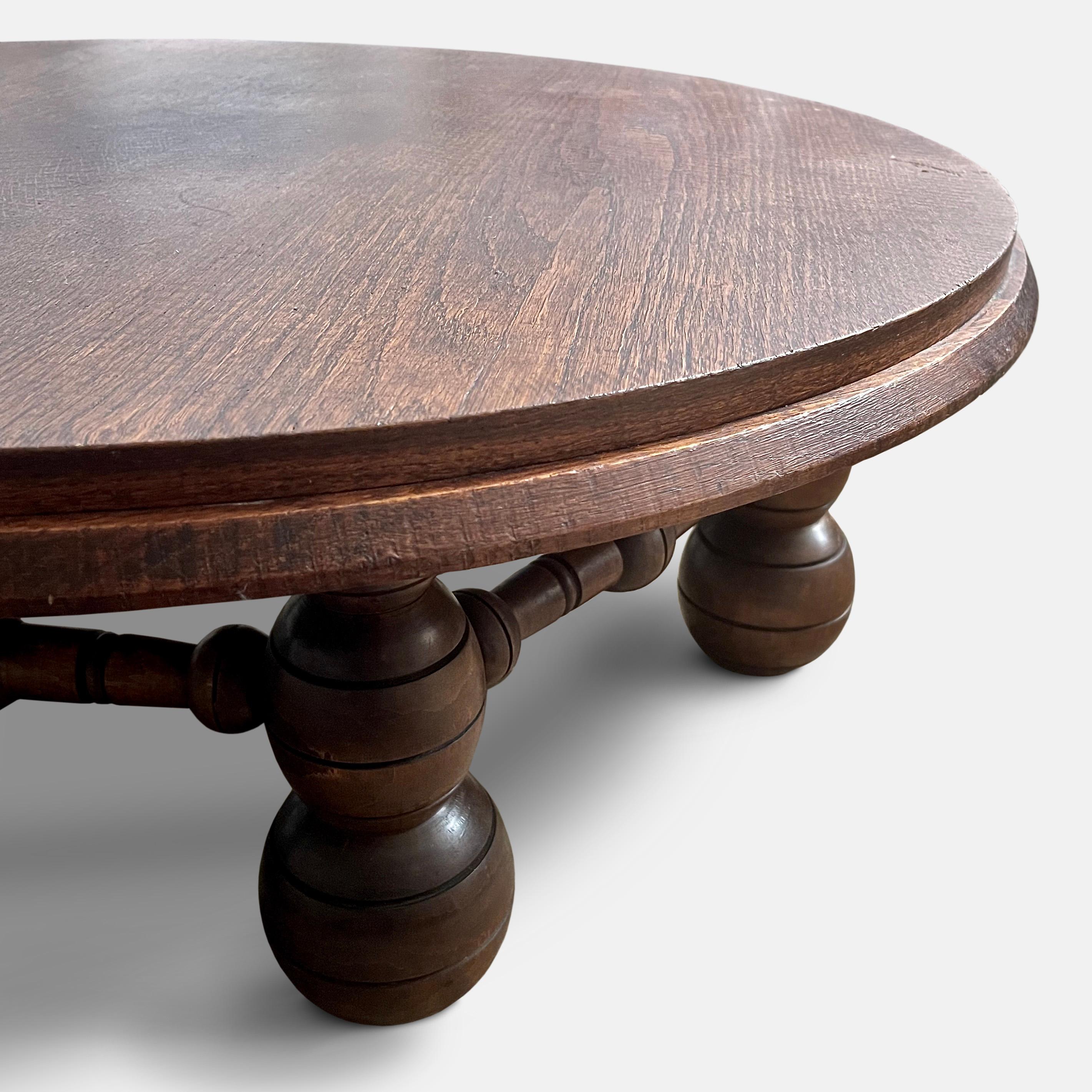 A large oak coffee table by Charles Dudouyt, circa 1940.
Known for his unique style that blended traditional French craftsmanship with modernist forms, Duduoyt's designs are characterised by clean lines, geometric shapes and use of natural