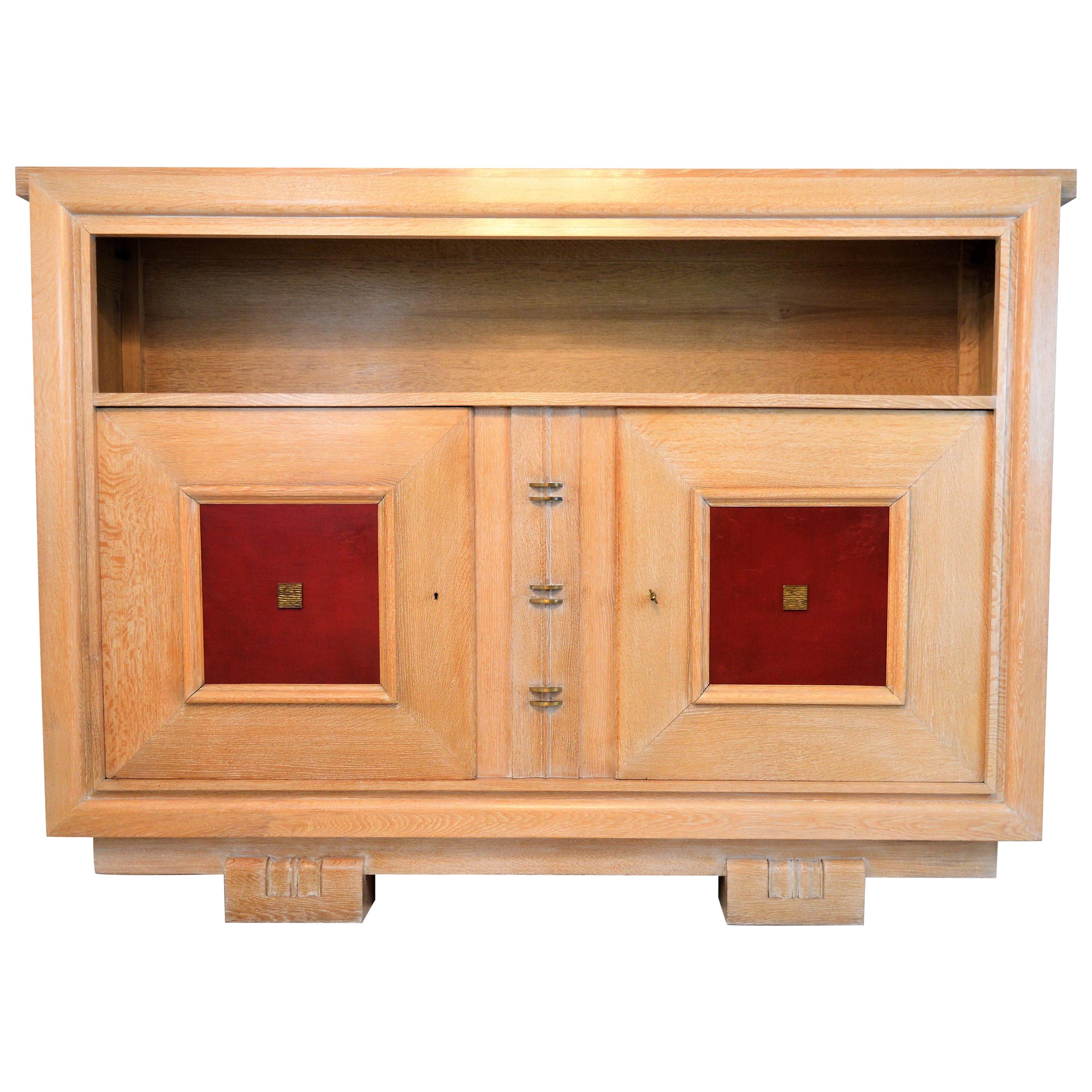 Charles Dudouyt Masterpiece Oak Cabinet, with Doorpanels Covered in Red Leather