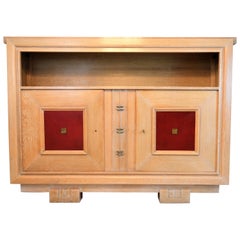 Charles Dudouyt Masterpiece Oak Cabinet, with Doorpanels Covered in Red Leather