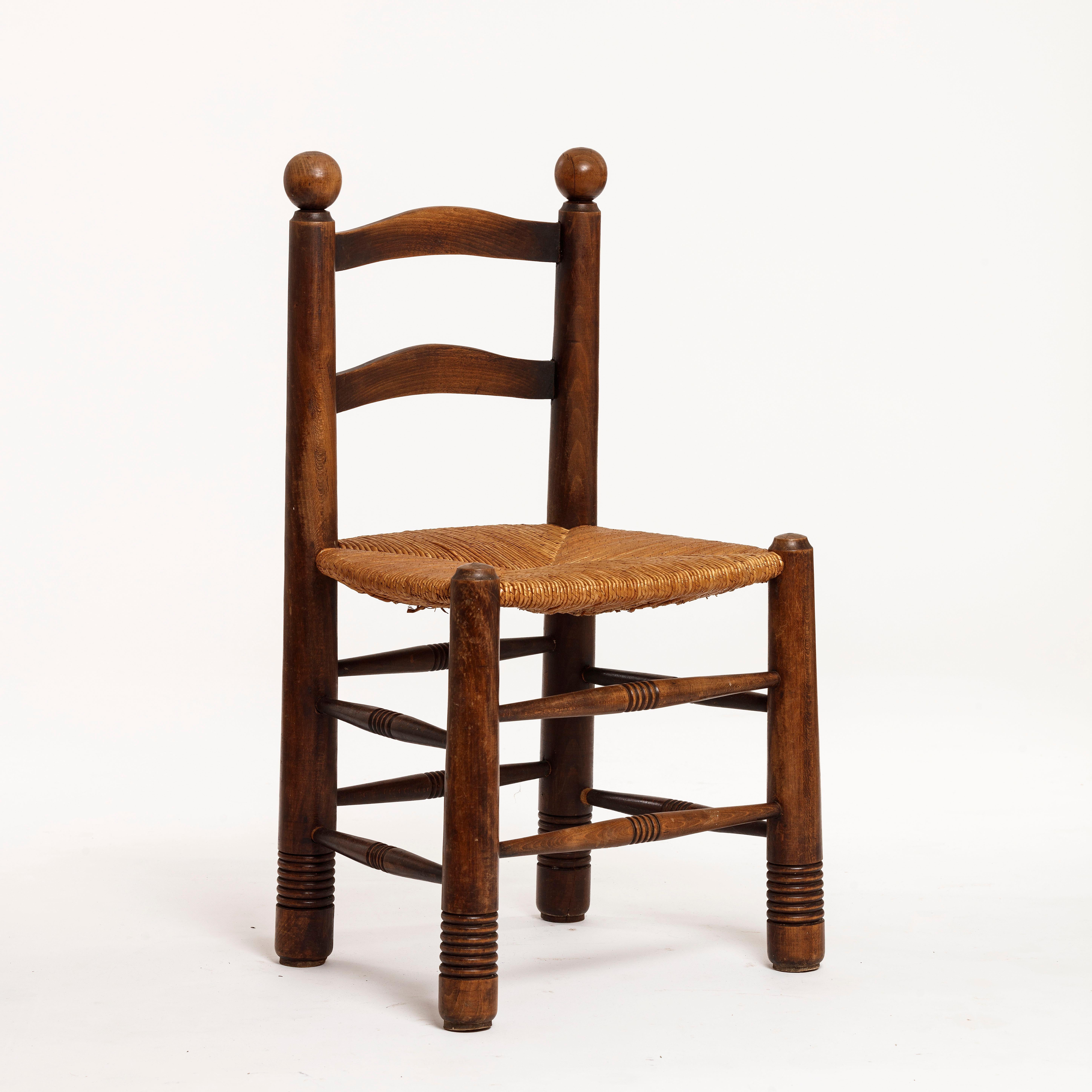 Painter and illustrator turned furniture designer Charles Dudouyt (1885-1946) sense of rusticity and modernism is strikingly present in this set of 1930s chairs.


