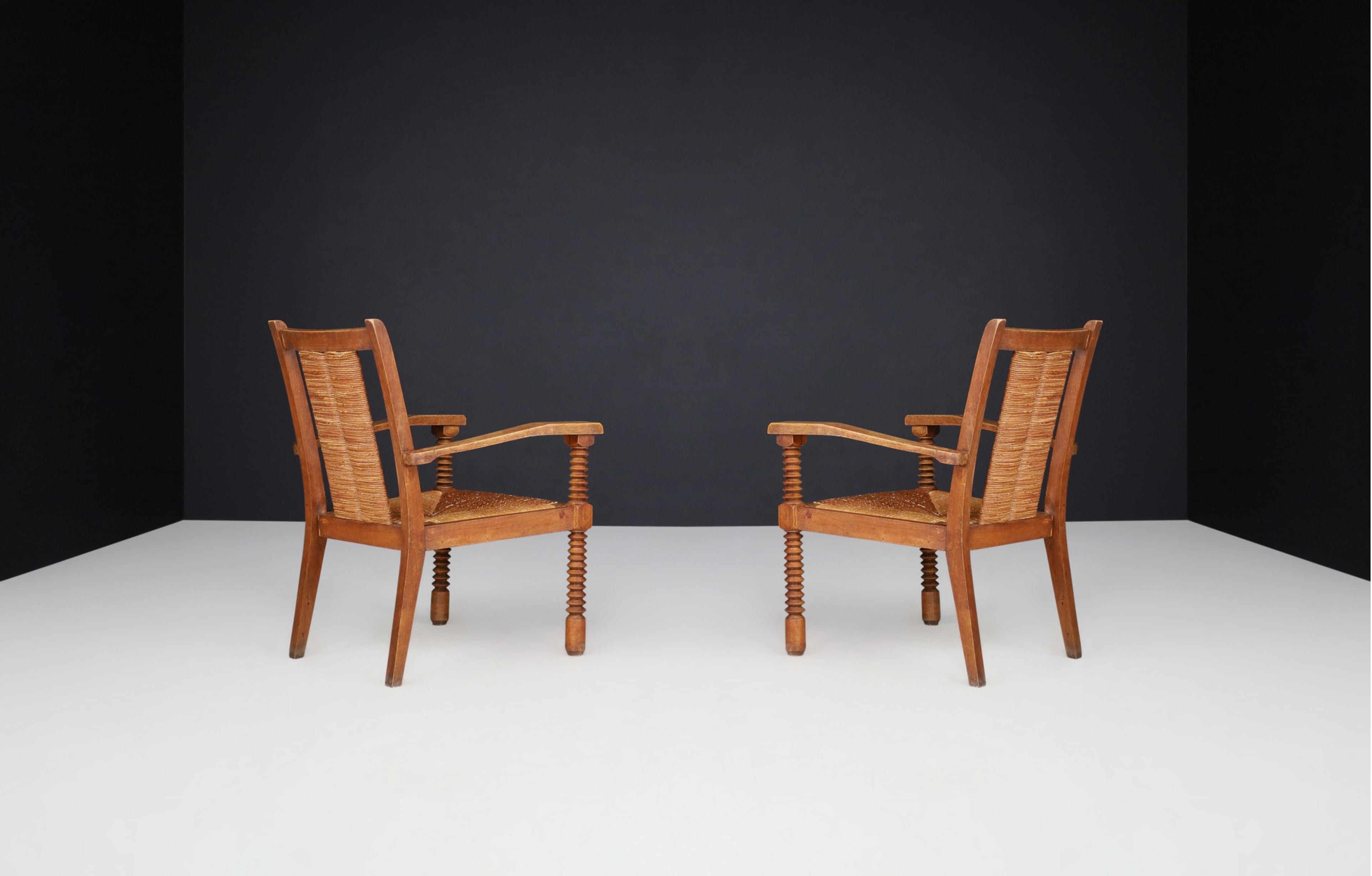 Charles Dudouyt Patinated Oak and Rush Armchairs, France 1940s In Good Condition For Sale In Almelo, NL
