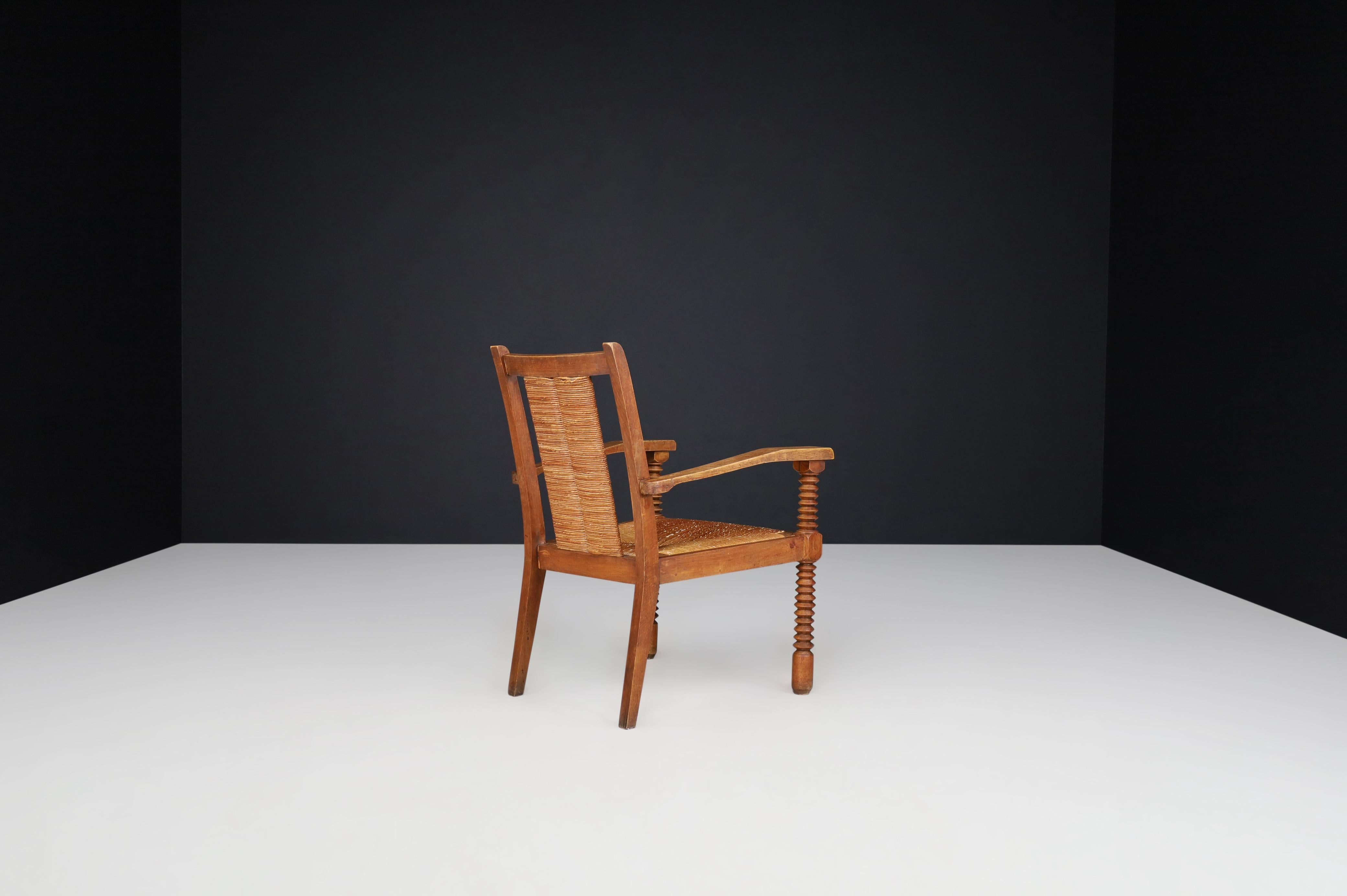 Charles Dudouyt Patinated Oak and Rush Armchairs, France 1940s For Sale 1