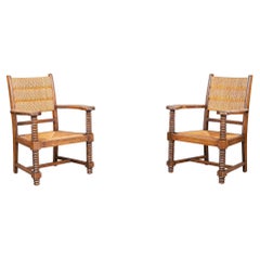 Charles Dudouyt Patinated Oak and Rush Armchairs, France 1940s