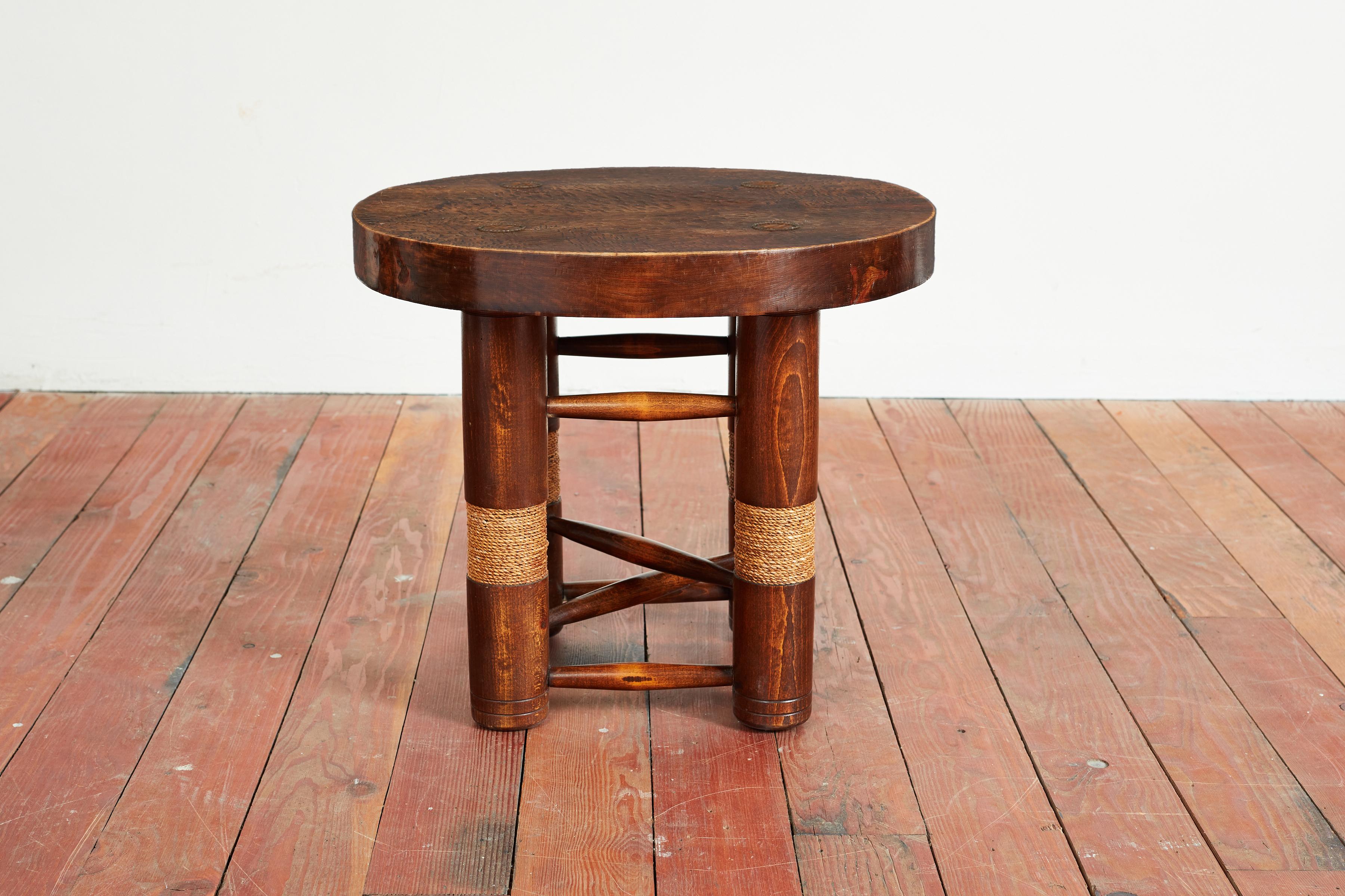 Fantastic rare side table by Charles Dudouyt with four wood cylindrical legs and carved wood and rope detailing. 
Top is hand carved etched with intricate copper nail detail.
