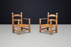 Charles Dudouyt Sculptural Walnut Armchairs with Rush Seats, France 1940s