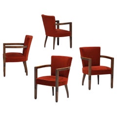 Charles Dudouyt - Ensemble de quatre fauteuils en chêne et velours rouge 