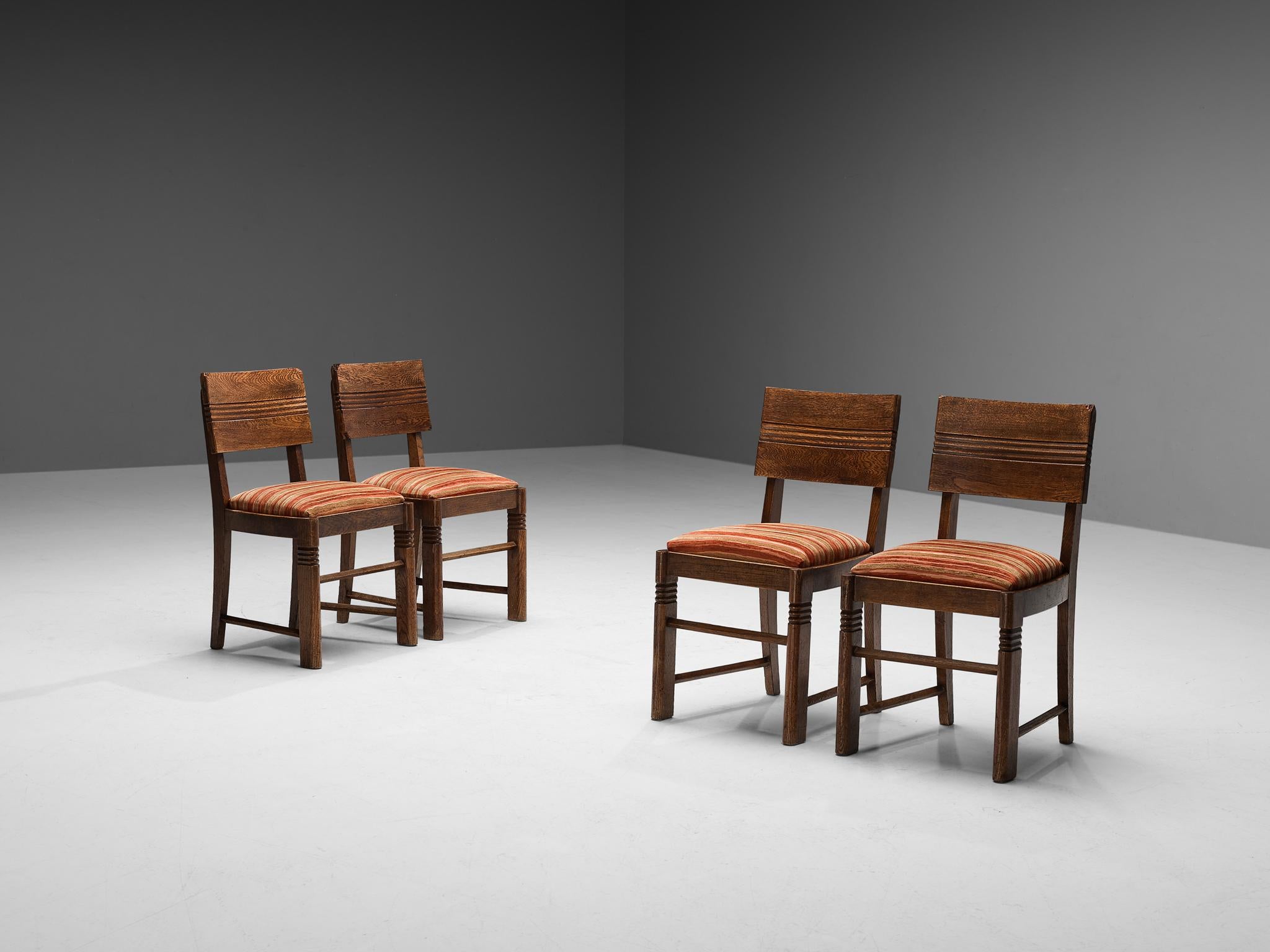 Charles Dudouyt, set of four dining chairs, fabric, oak, France, 1930s 

These beautifully designed chairs are created in one of the most influential periods for the arts namely the Art Deco Movement. The oak frame is based on round edges and