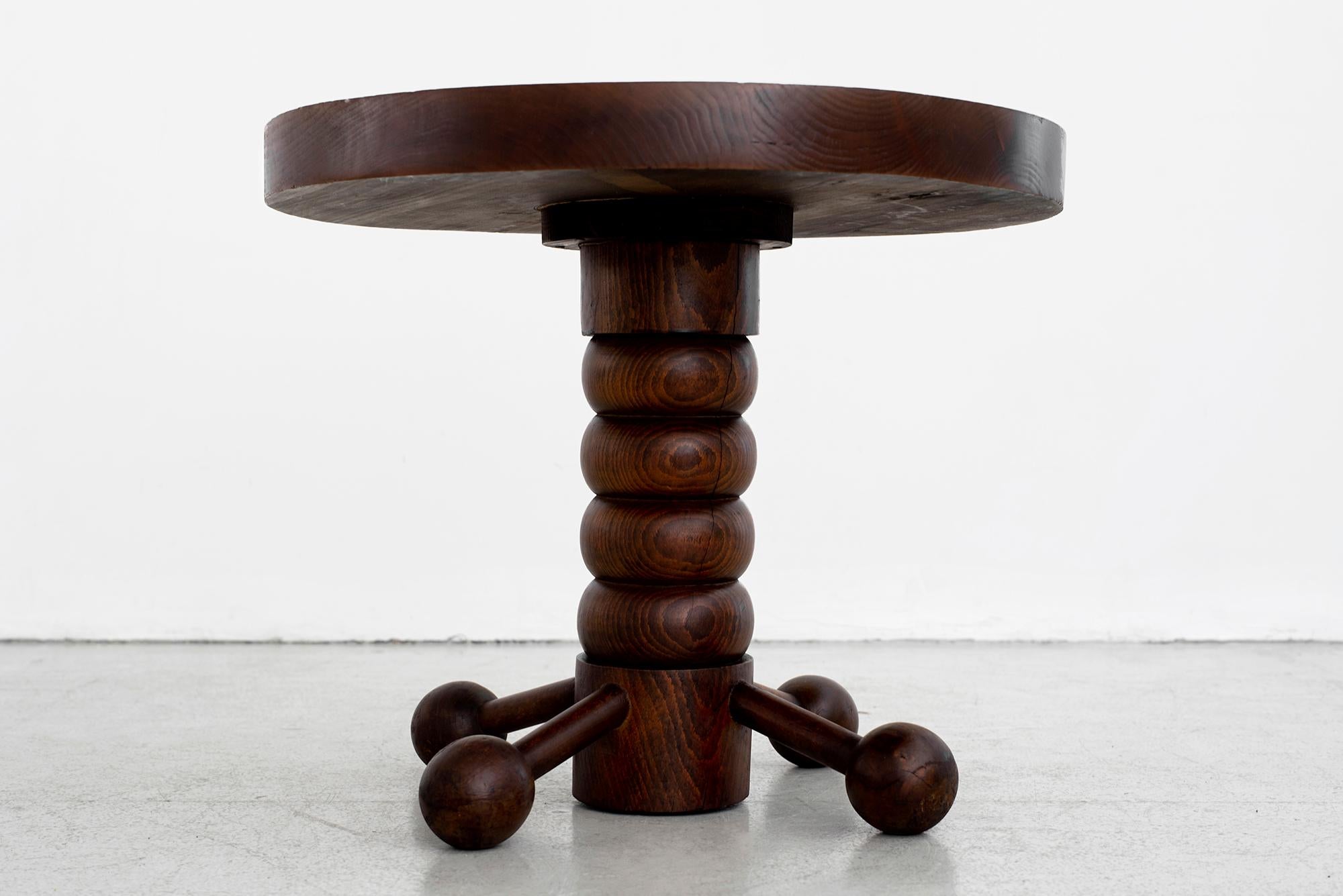 Great sculptural side table by Charles Dudouyt with four wood balled feet and carved corkscrew base.
Carved wood top.
Wonderful patina throughout.