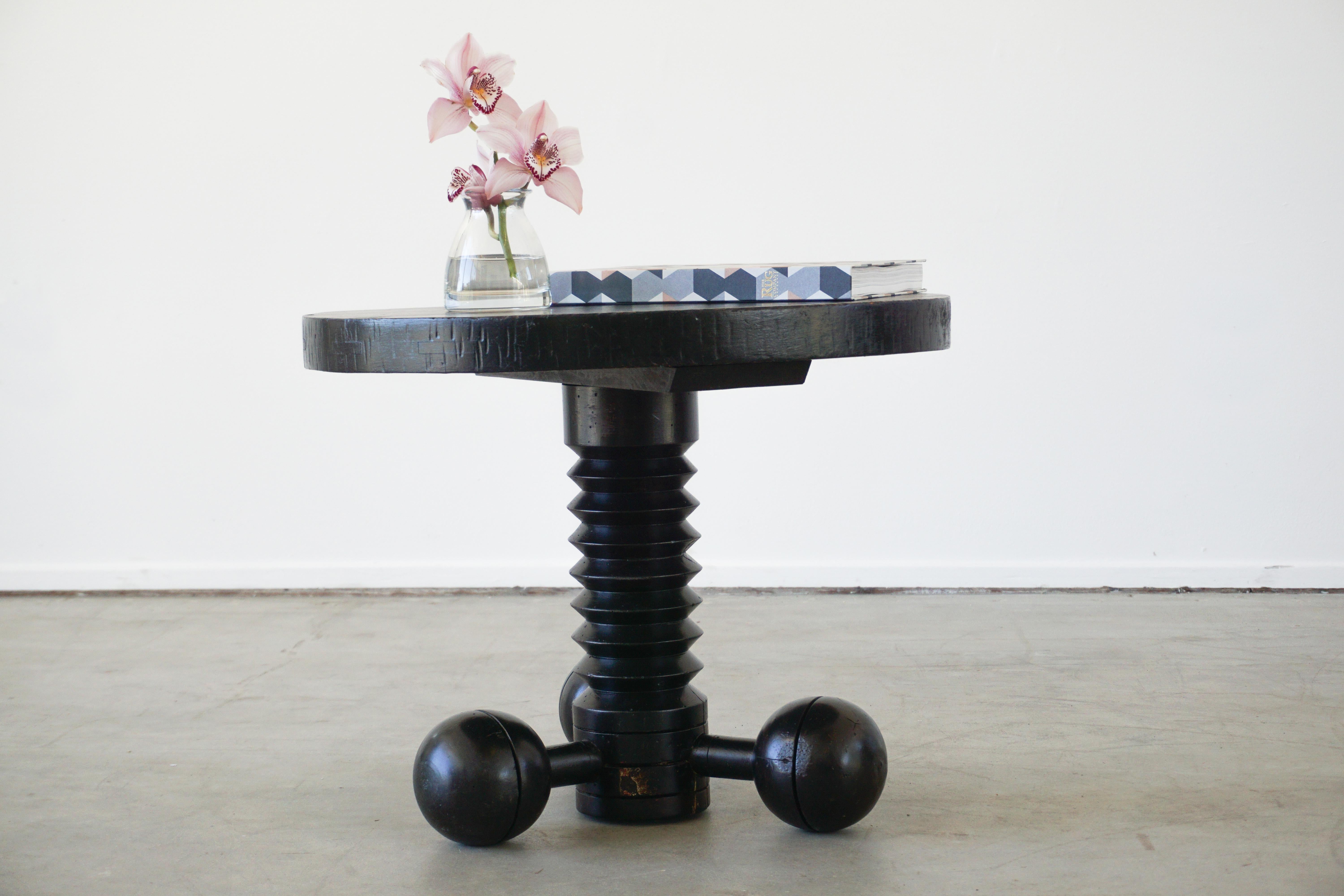 Great sculptural side table by Charles Dudouyt with three wood balled feet and carved corkscrew base, and carved top. Wonderful patina throughout.