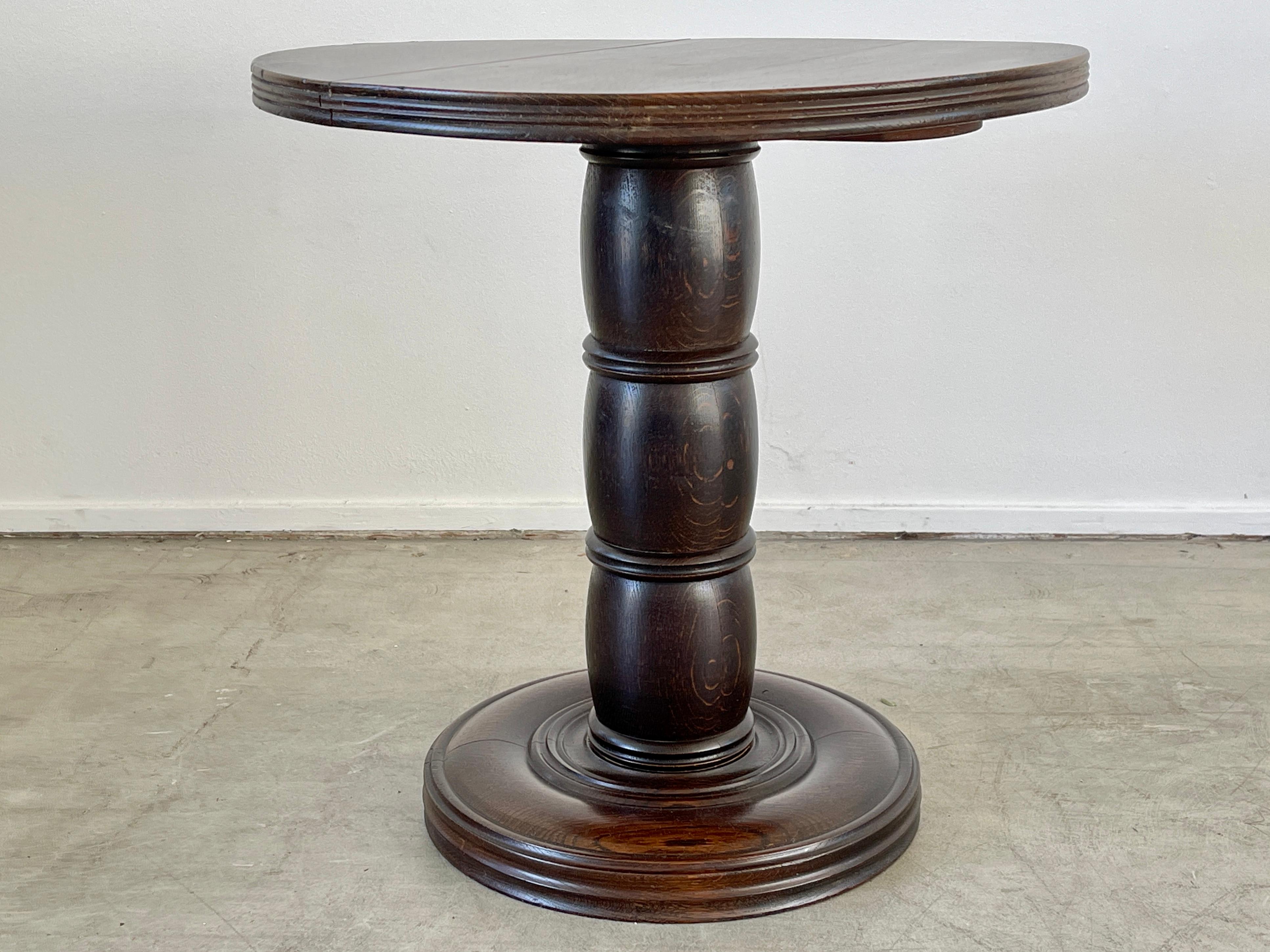 Charles Dudouyt style side table with wonderful patina, carved pedestal base.