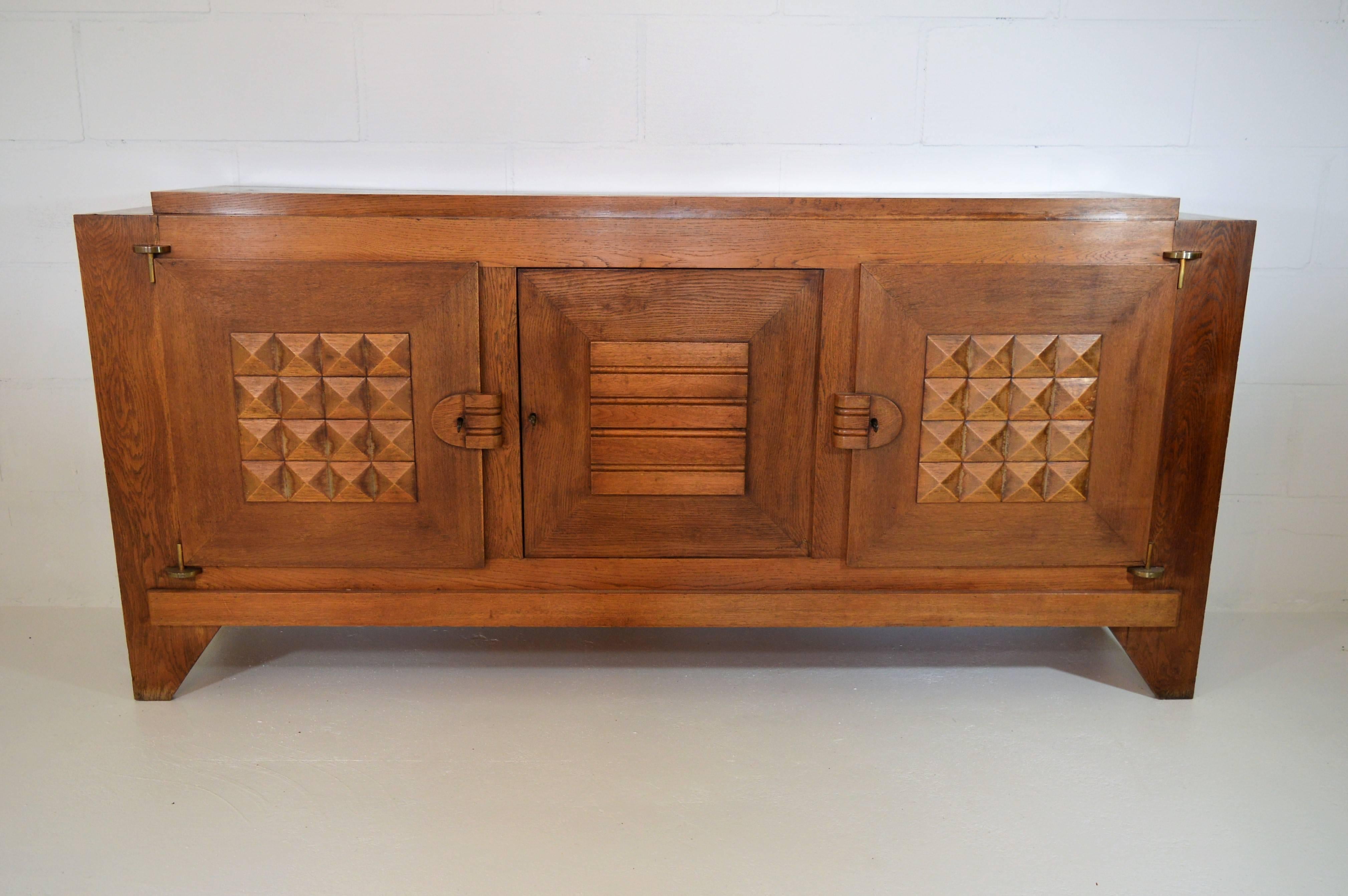 Early sideboard in oak by Charles Dudouyt, created in the 1930s. This sideboard remains in his original unrestored condition.