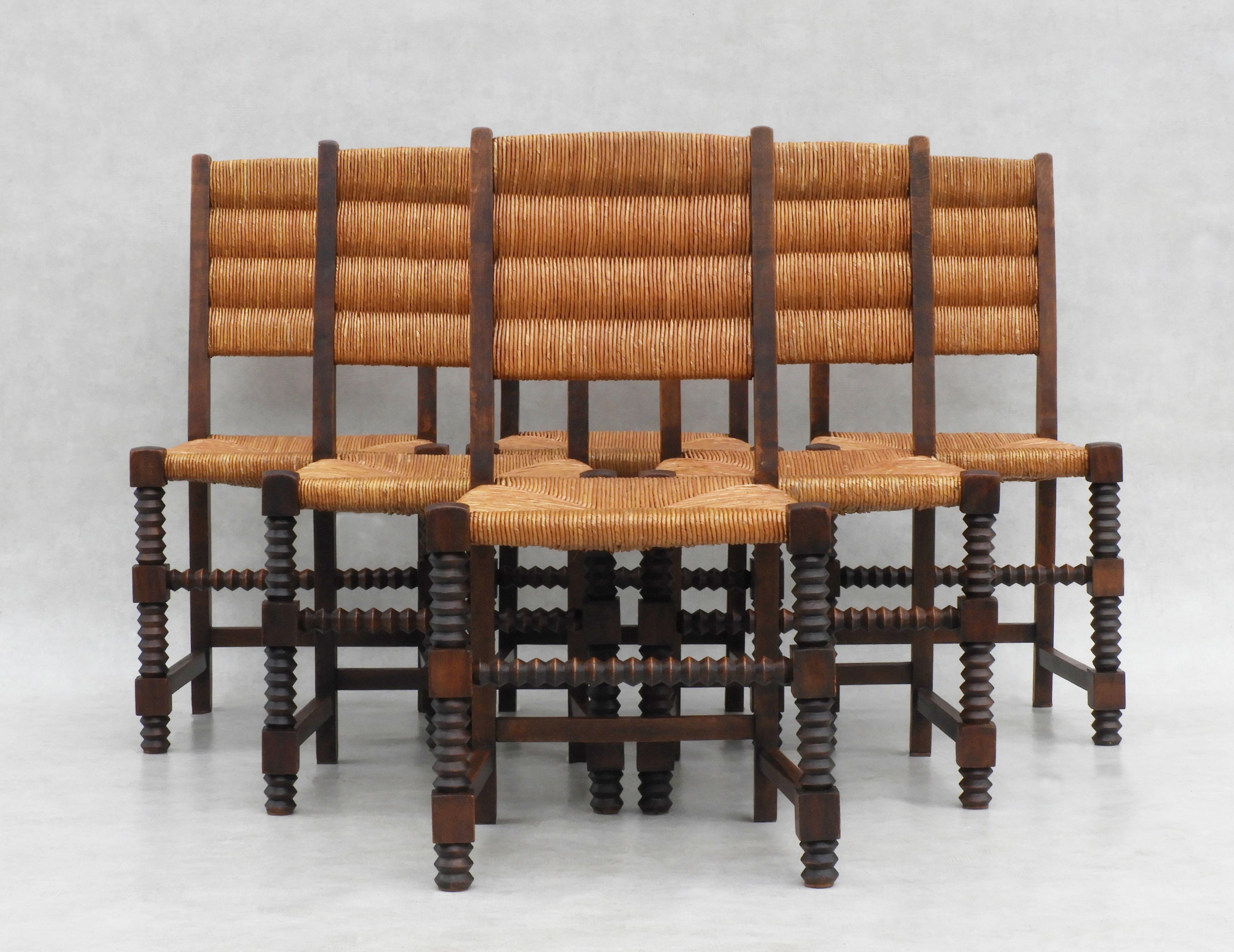 Set of six French oak and rush and seat dining chairs, in the style of Charles Dudouyt/Gentilhommière C1950.           
Great design and good craftsmanship. All original carved oak frames and rush work. In good vintage condition, sound, solid and
