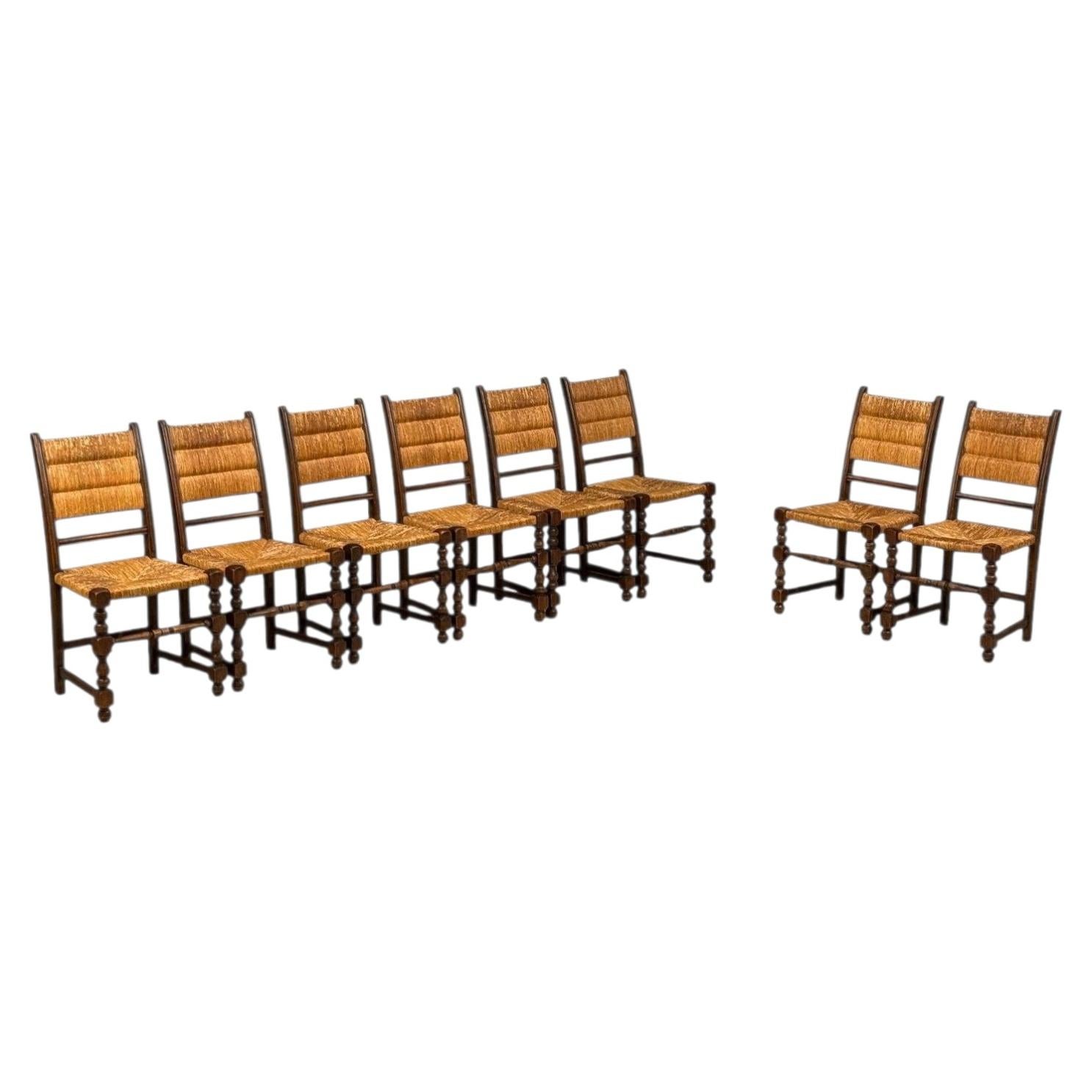 Charles Dudouyt Style, Eight Rustic Dining Chairs, Oak, Rush, France, 1940s For Sale