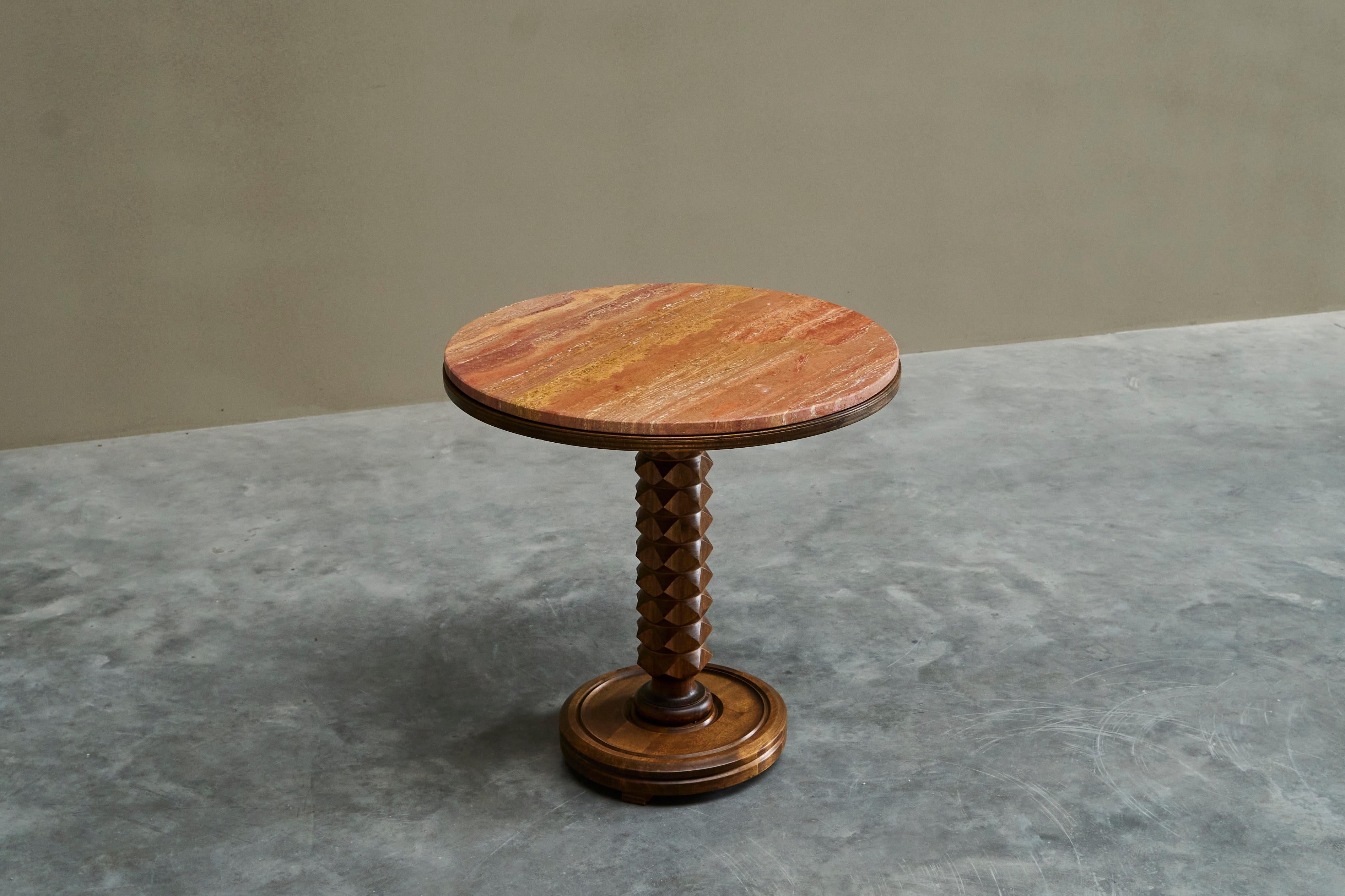 Charles Dudouyt Style Pedestal Side Table in Wood and Red Travertine 1930s.

A very handsome pedestal side or center table with a top in red travertine in the manner of Charles Dudouyt.

Beautiful geometrically carved stem in solid wood on a nicely