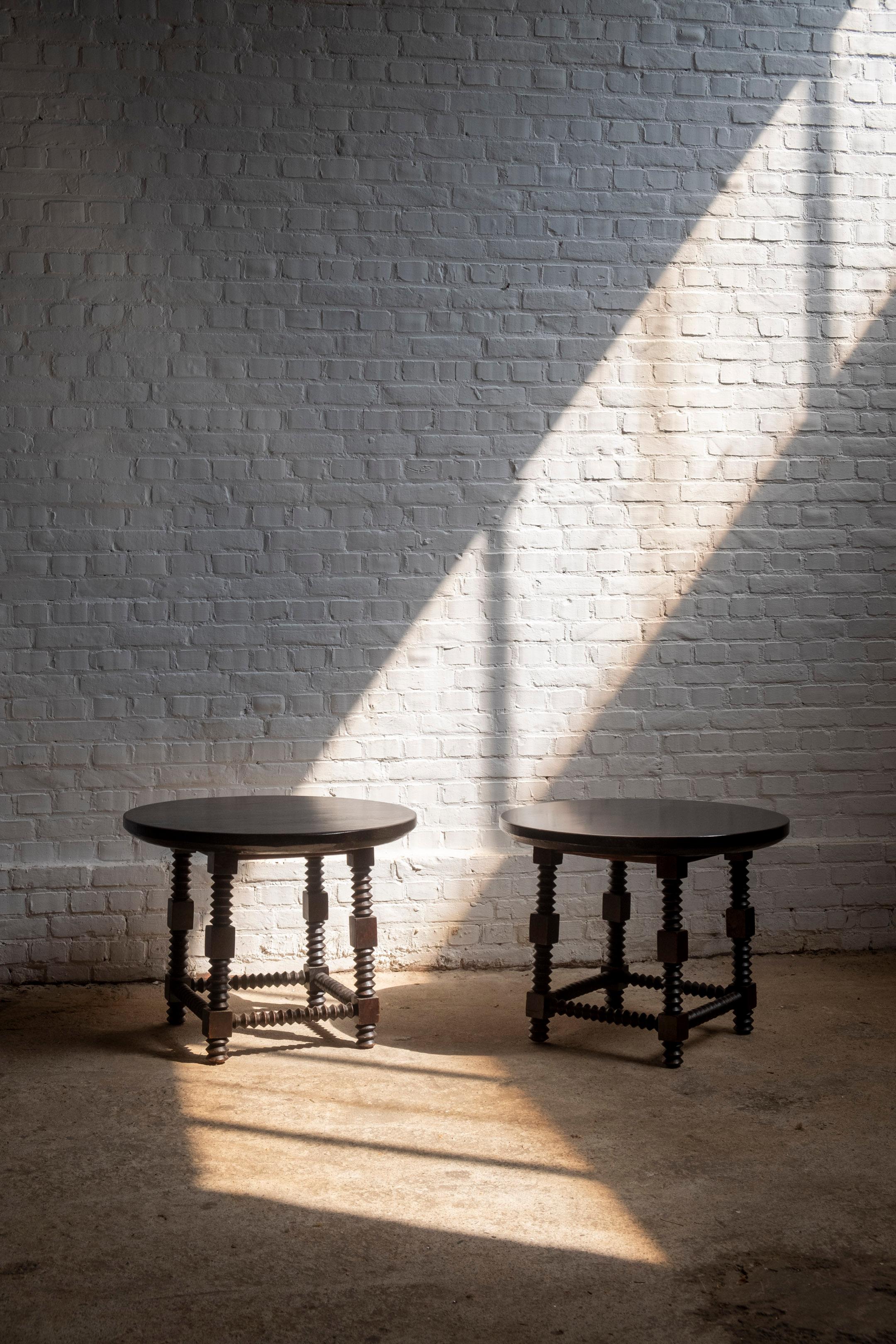 Elevate your interior decor with this exquisite pair of vintage side tables, crafted in the distinctive style of Charles Dudouyt. Renowned for his innovative approach to furniture design, Dudouyt’s influence is evident in the robust, yet elegant
