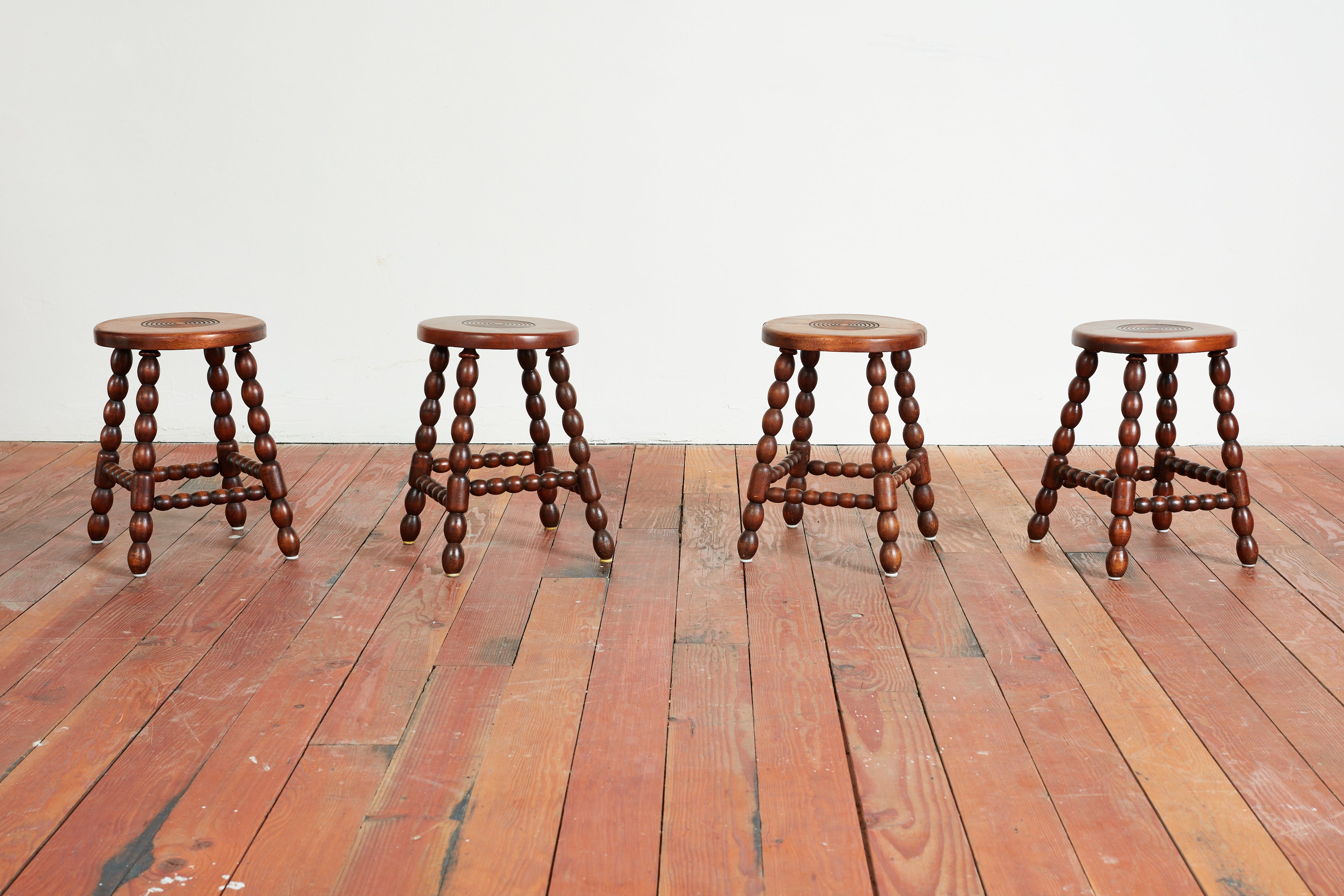 Charles Dudouyt attributed carved stools with carved legs and seats.