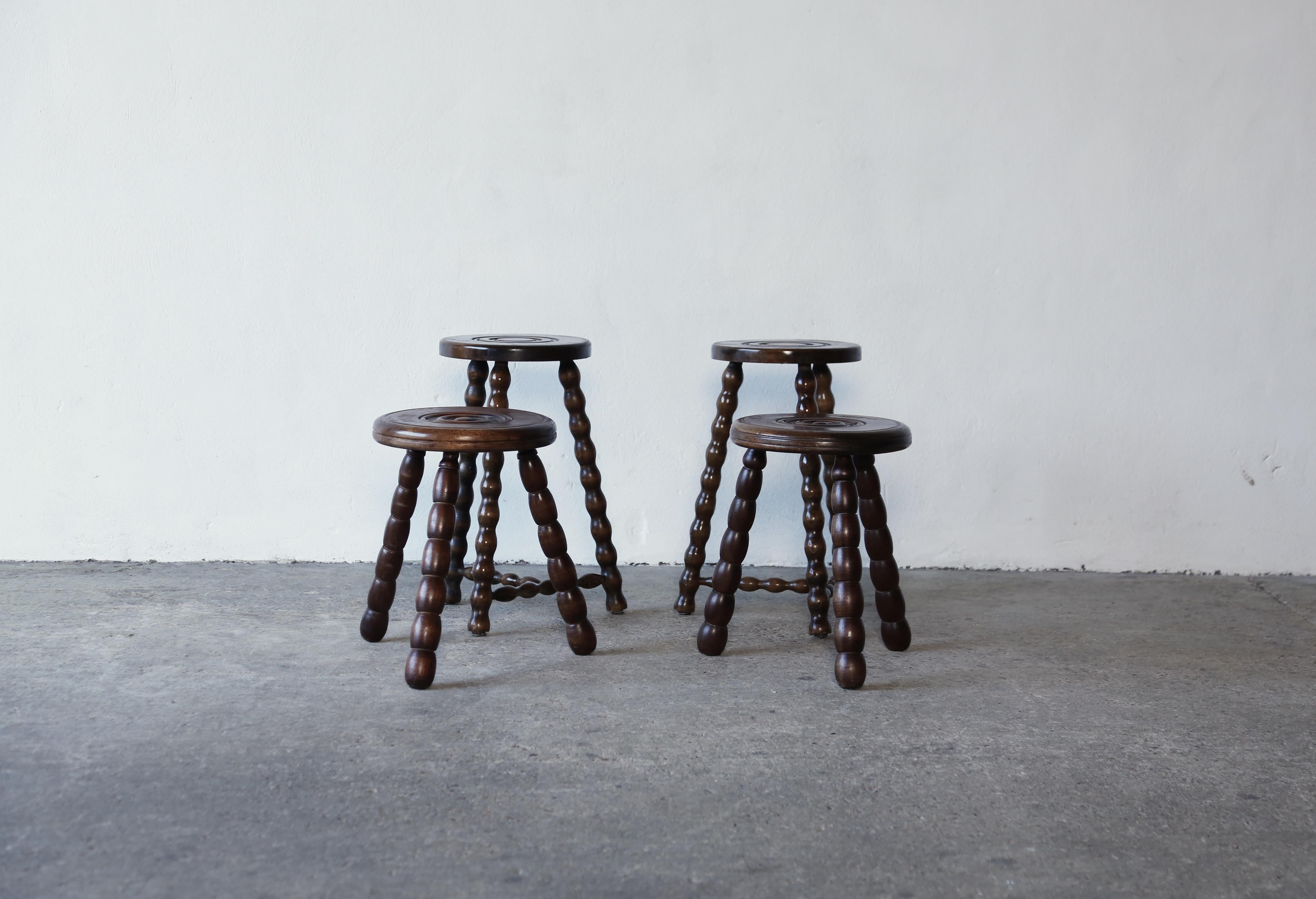 A set of Charles Dudouyt stools, France, 1950s.  Stable, ready to use condition.   The price is for the set of 4 but can also sell individually.   Fast shipping worldwide.

Stools Taller Pair Dims: W30 H52cm
Stools Smaller Pair Dims: W38 H42cm


