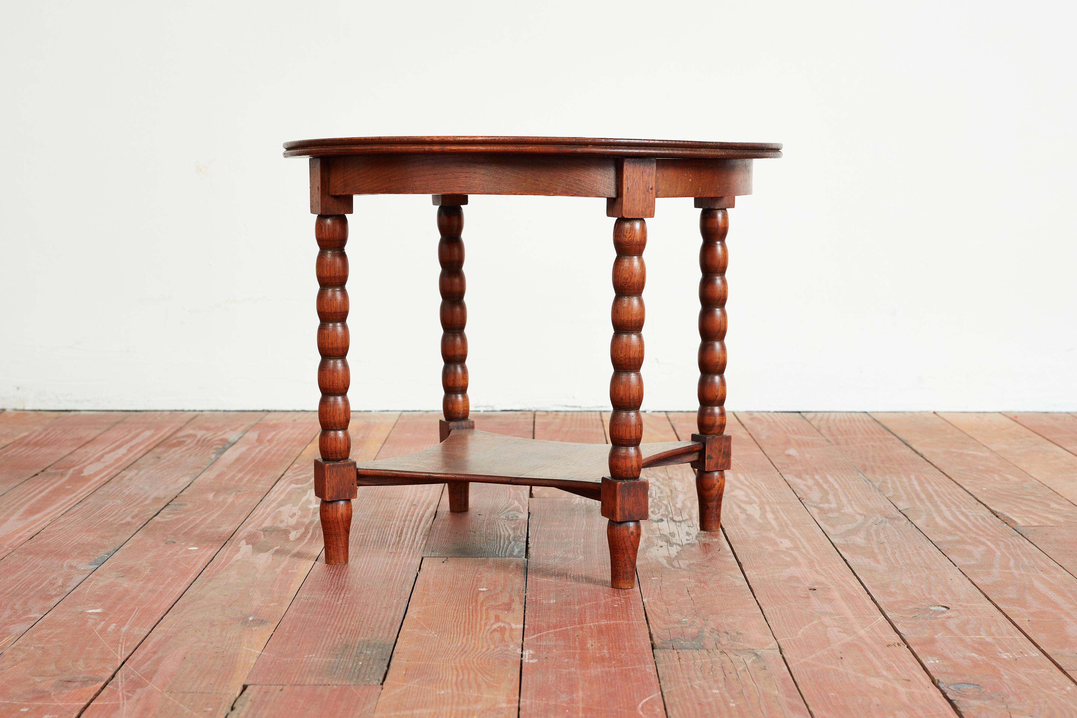 Charles Dudouyt style side table with carved legs and wonderful patina.