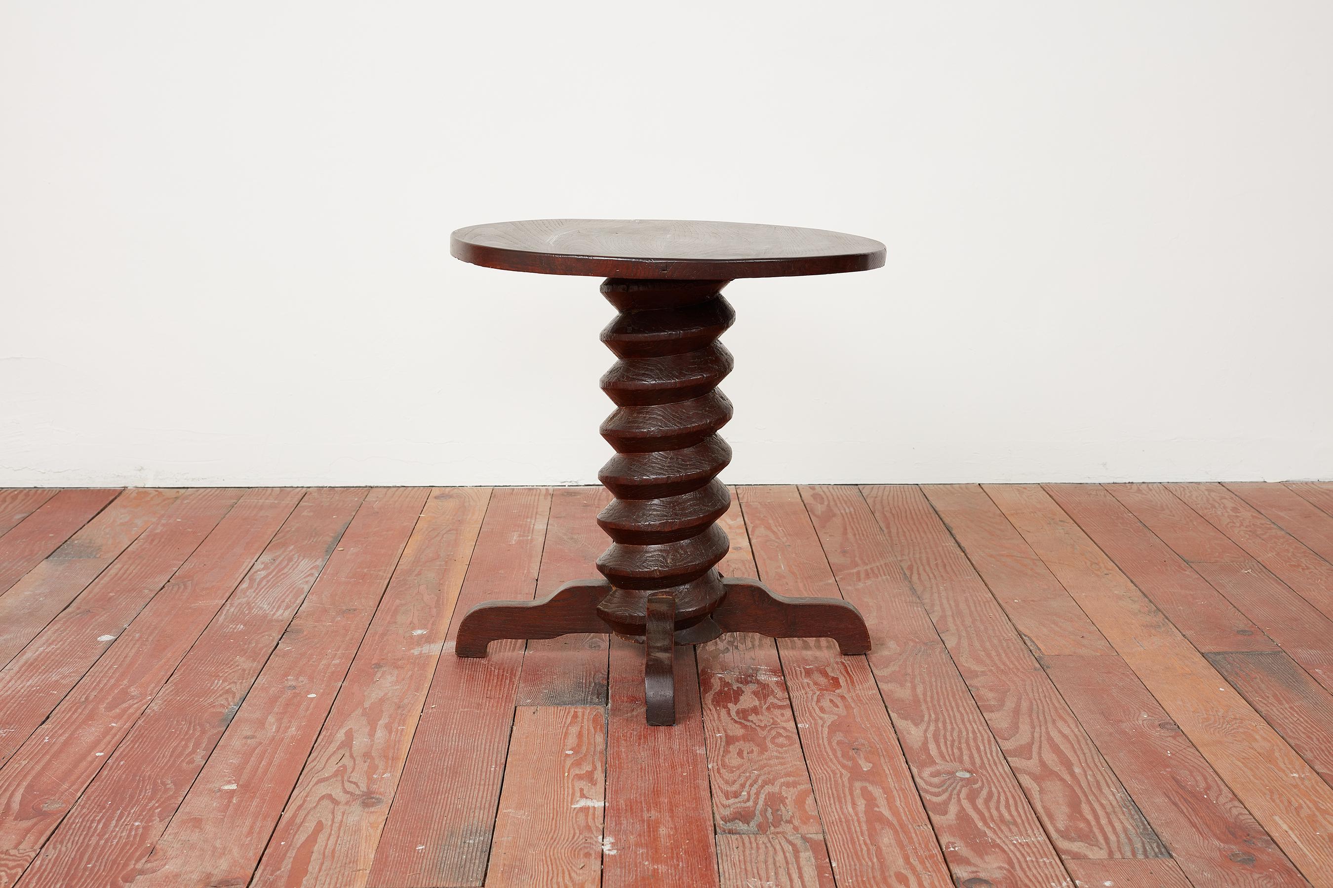 Rare table by Charles Dudouyt with thick signature corkscrew pedestal with curved legs. 
Wonderful rich patina to oak.