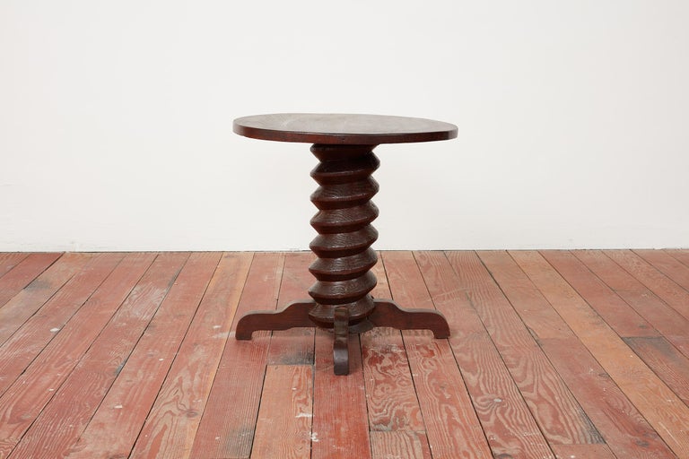 Rare table by Charles Dudouyt with thick signature corkscrew pedestal with curved legs. 
Wonderful rich patina to oak.