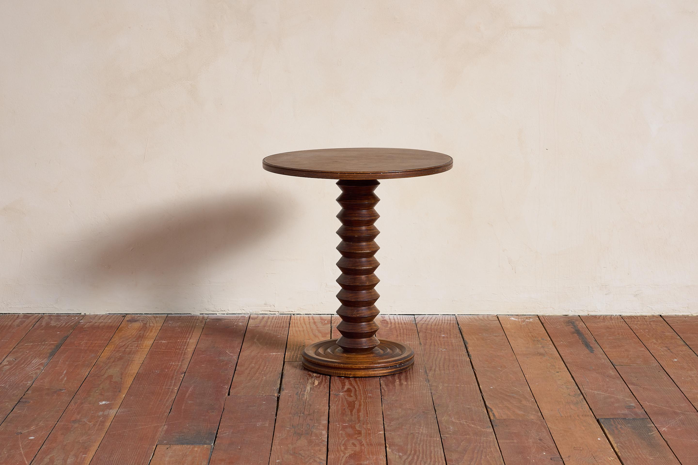 Charles Dudouyt side table with signature corkscrew base - France, 1940s

Thick pedestal with circular concentric base. 

Wonderful warm patina.