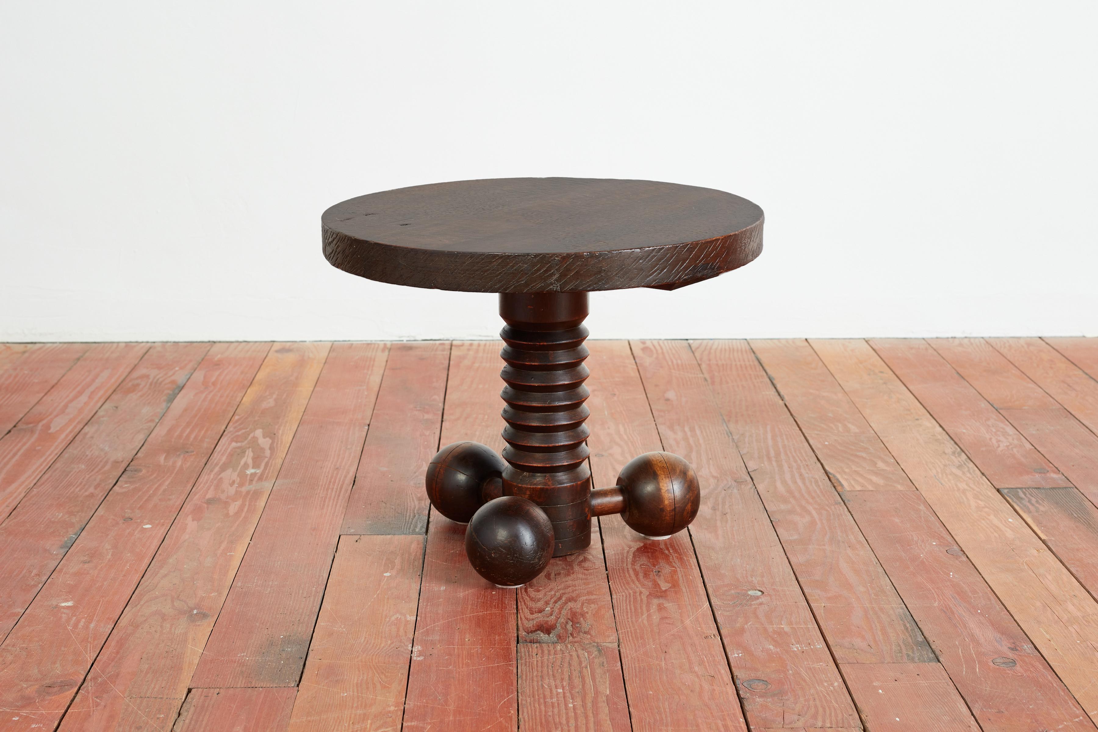 Great sculptural side table by Charles Dudouyt with three wooden balled feet and signature carved corkscrew base. 
Wonderful rich wood patina throughout.
 
