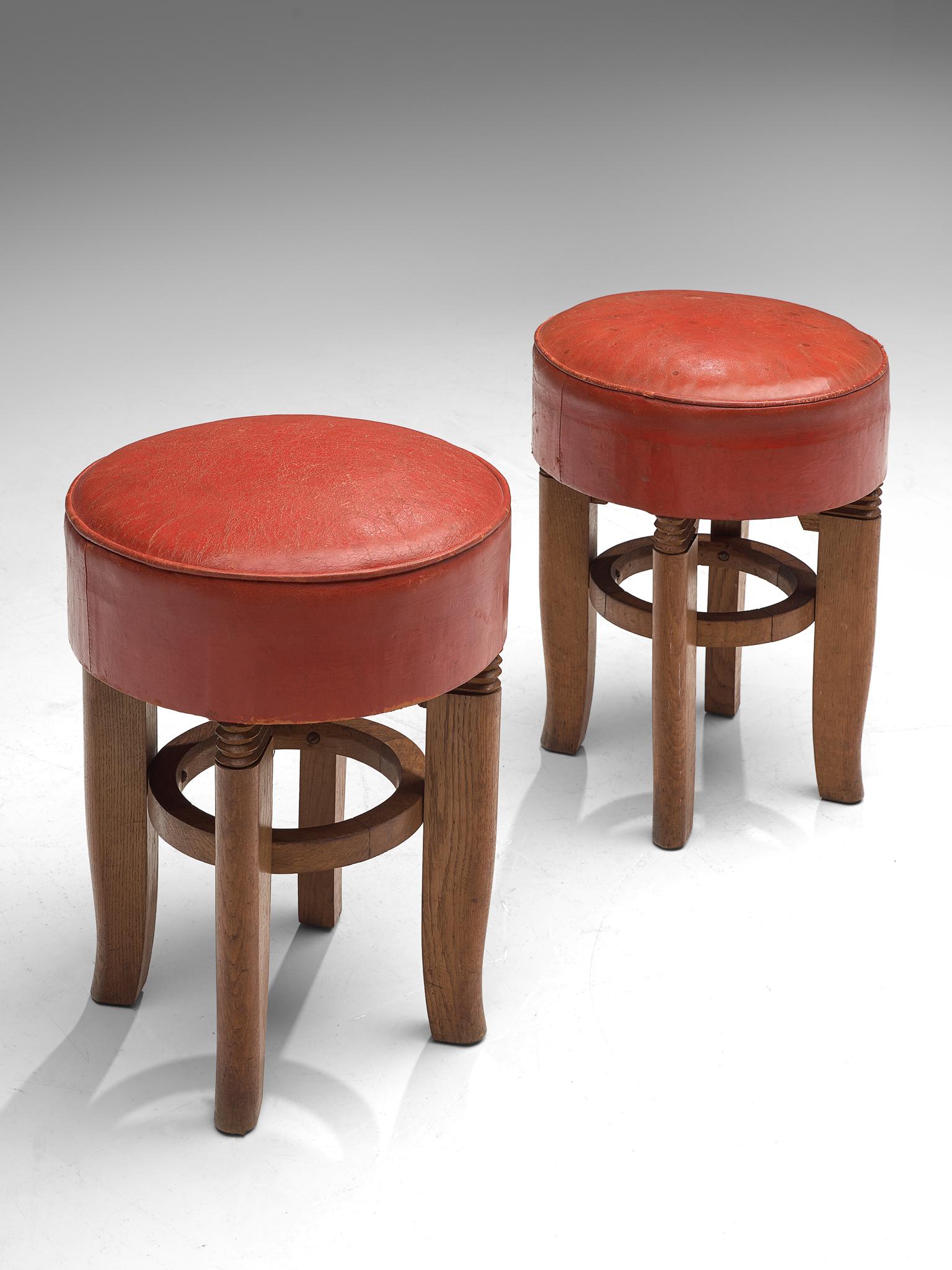 Charles Dudouyt, two stools, leather and oak, France, 1930s

Set of two Art Deco stools by the French maker Charles Dudouyt. The seats feature the typical characteristics of the maker, such as the decorative carved lines shown on the legs. The