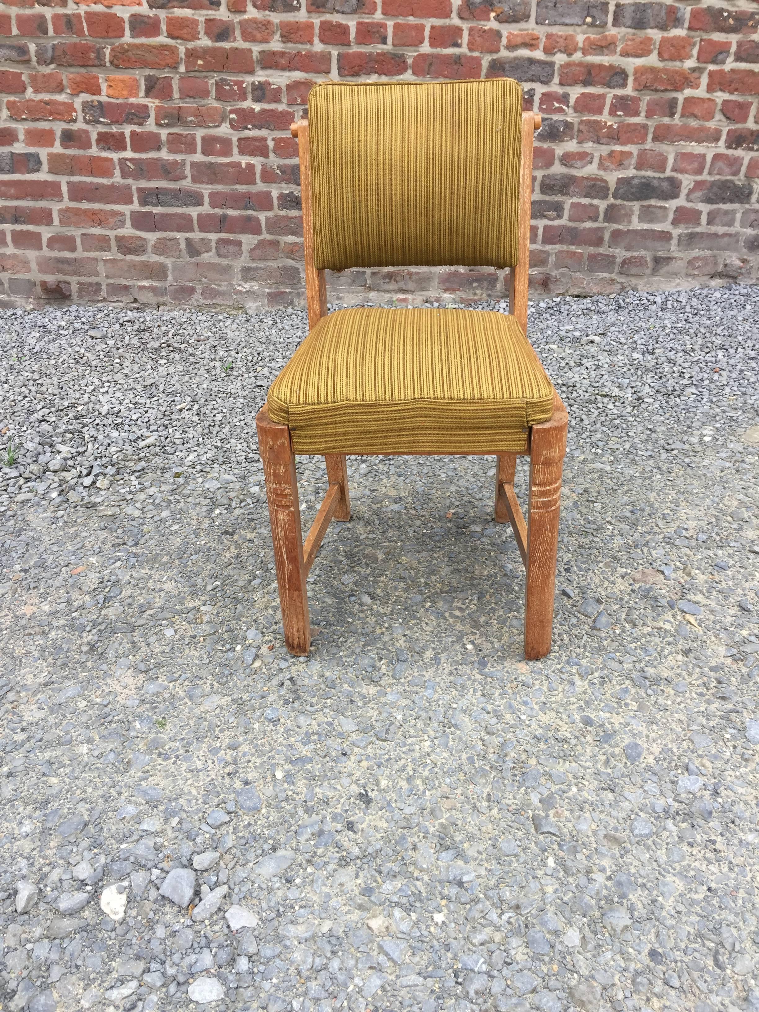 Charles Dudouyt, set of six oak and velvet chairs, circa 1940.
A back missing. 