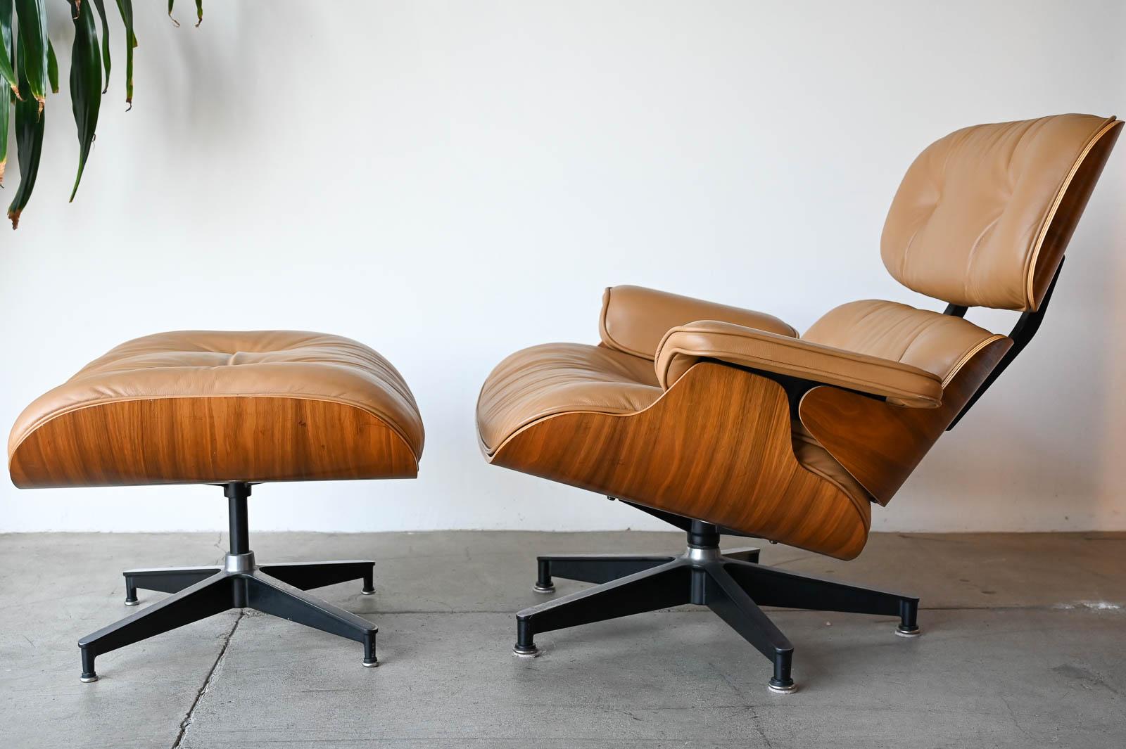 Charles Eames 670/671 Walnut and Leather Lounge Chair and Ottoman, 2004, Beautiful example of a near perfect unrestored lounge chair and ottoman. The frame of this chair is in excellent condition, shock mounts are solid and no chips to edges of